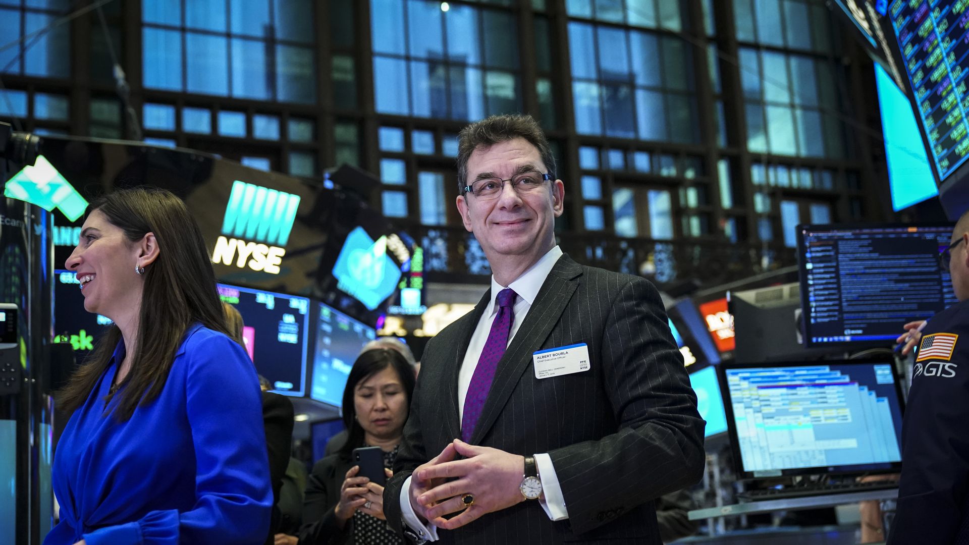 Pfizer CEO Albert Bourla stands on the New York Stock Exchange floor.