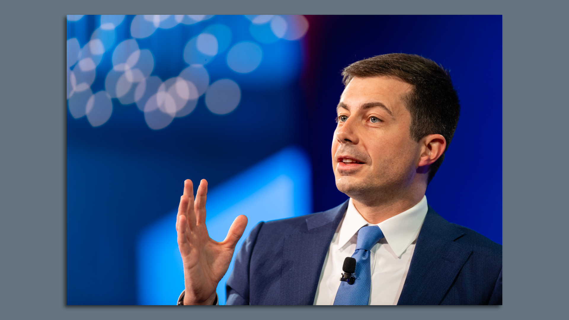 Transportation Sec. Pete Buttigieg gesturing to an audience