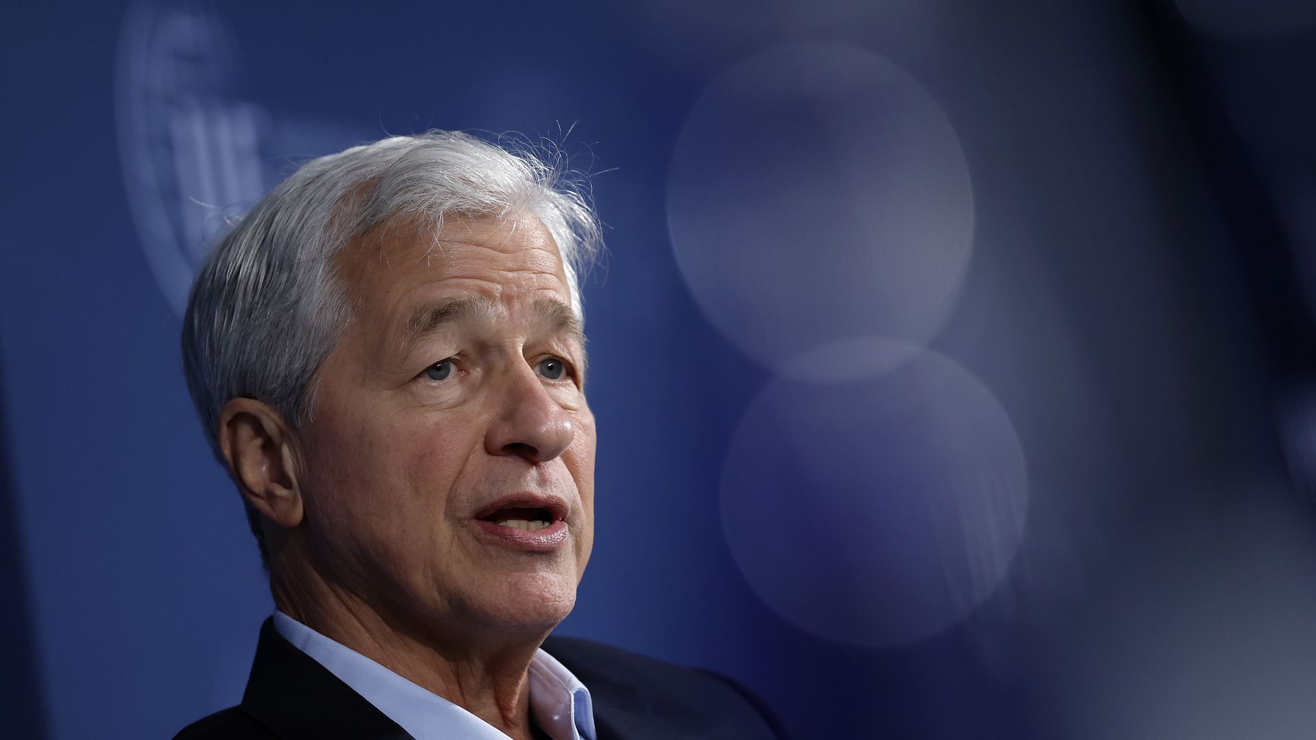 JPMorgan CEO Jamie Dimon speaks from a stage at a 2024 event. 