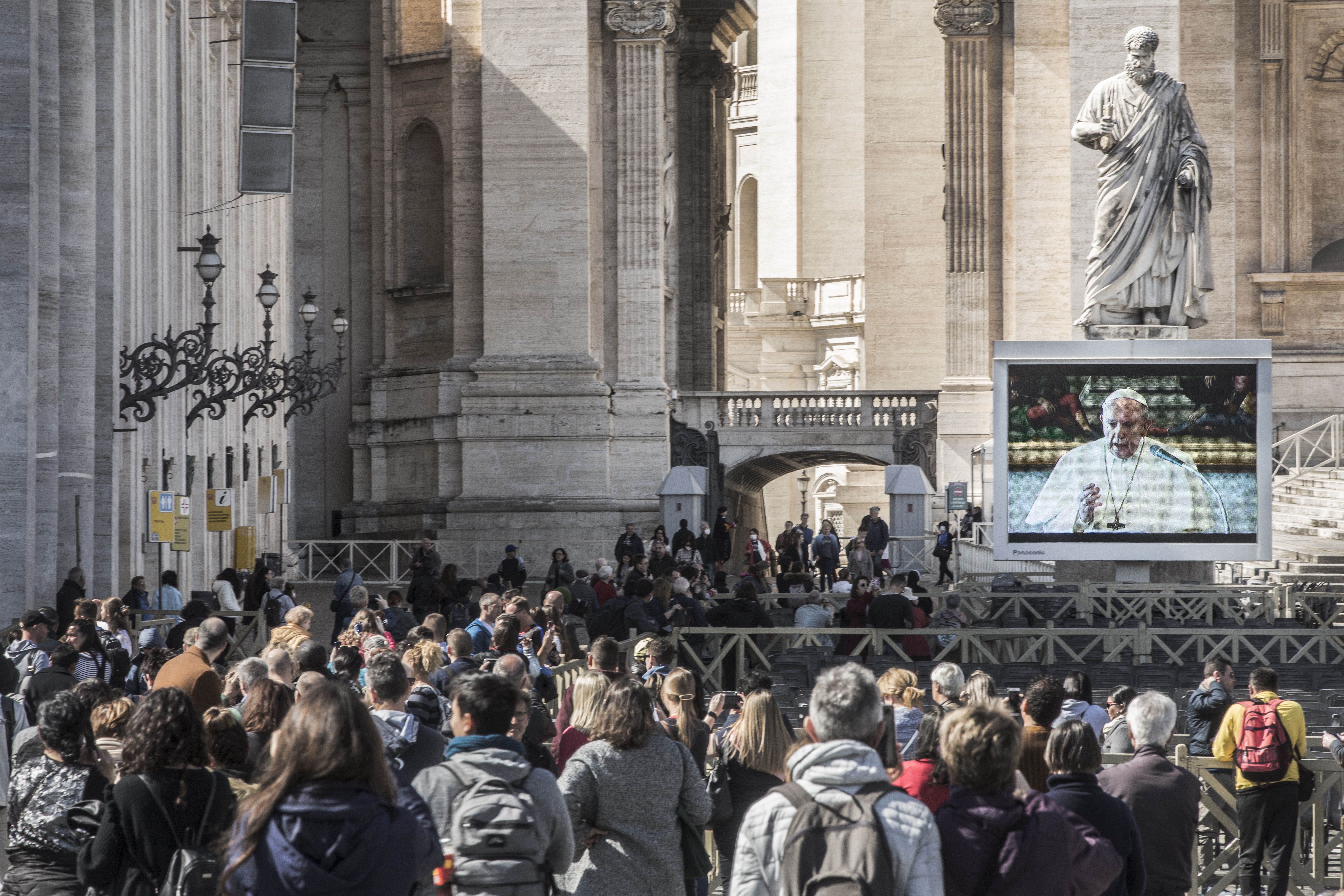 People watching watch the live broadcast of Pope Francis angelus Prayer