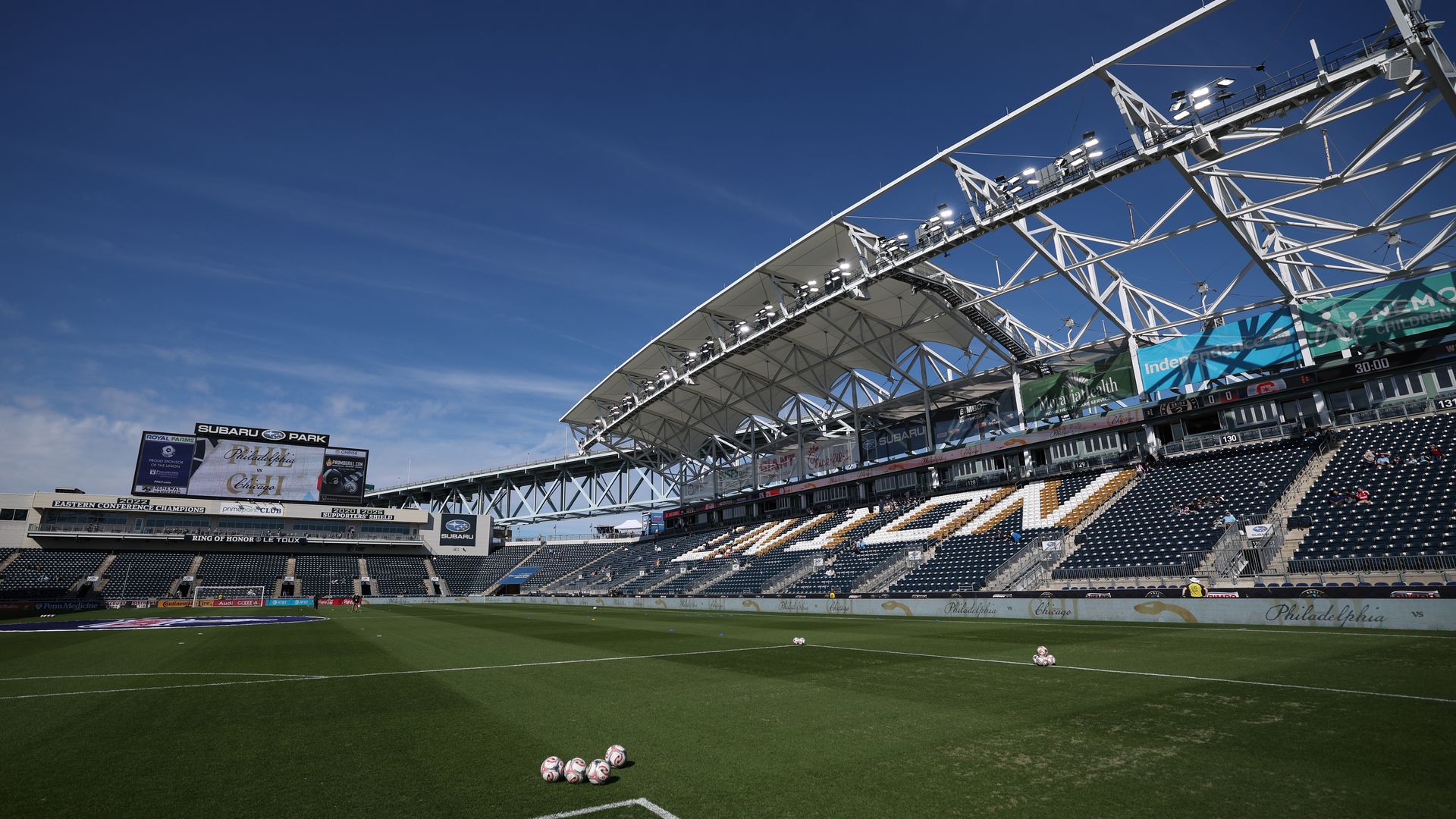 A view of the field inside the Philadelphia Union's stadium, surrounded by empty blue stands.