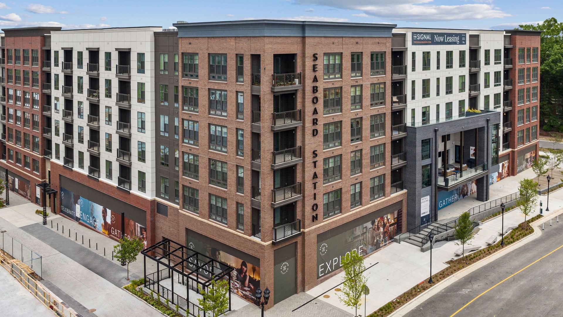 An apartment building with retail underneat 