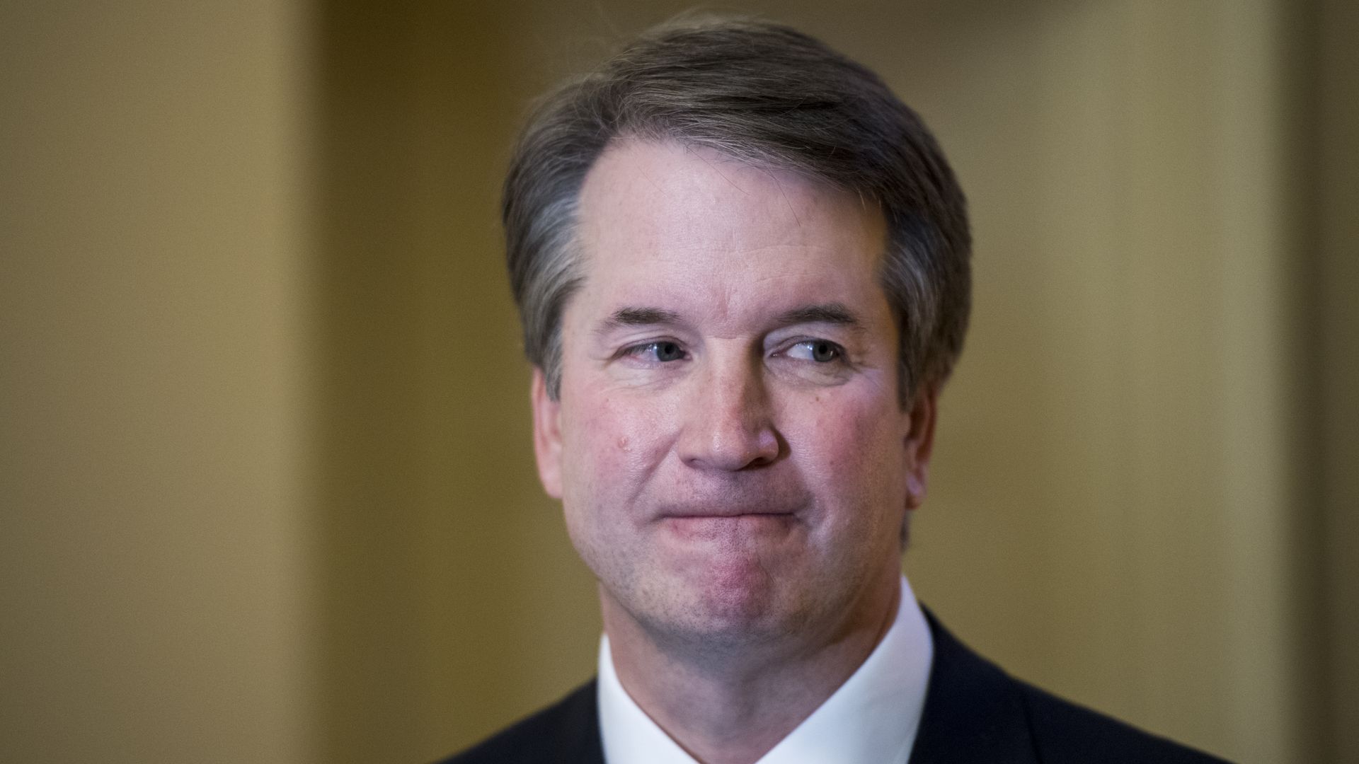 Close up of Brett Kavanaugh biting his lip