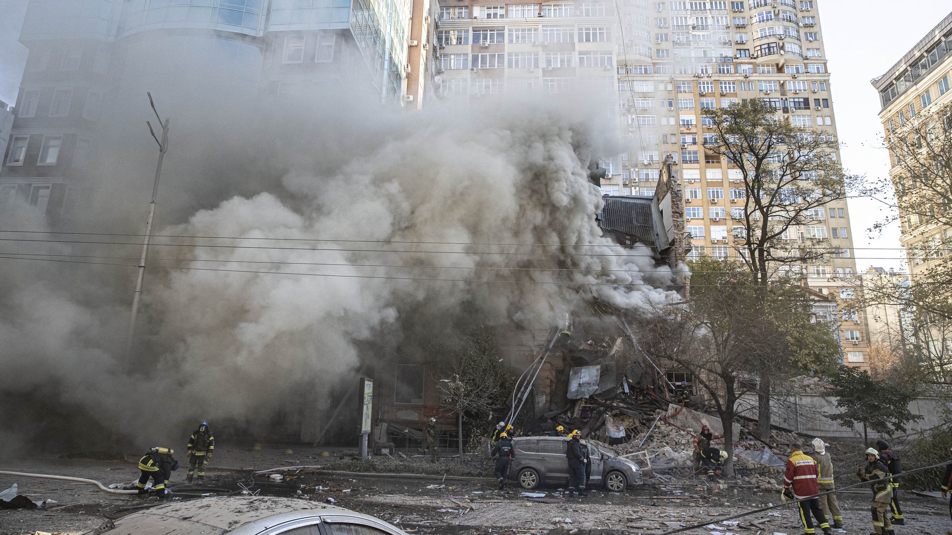  Firefighters conduct work in a destroyed building after Russian attacks in Kyiv, Ukraine on October 17.