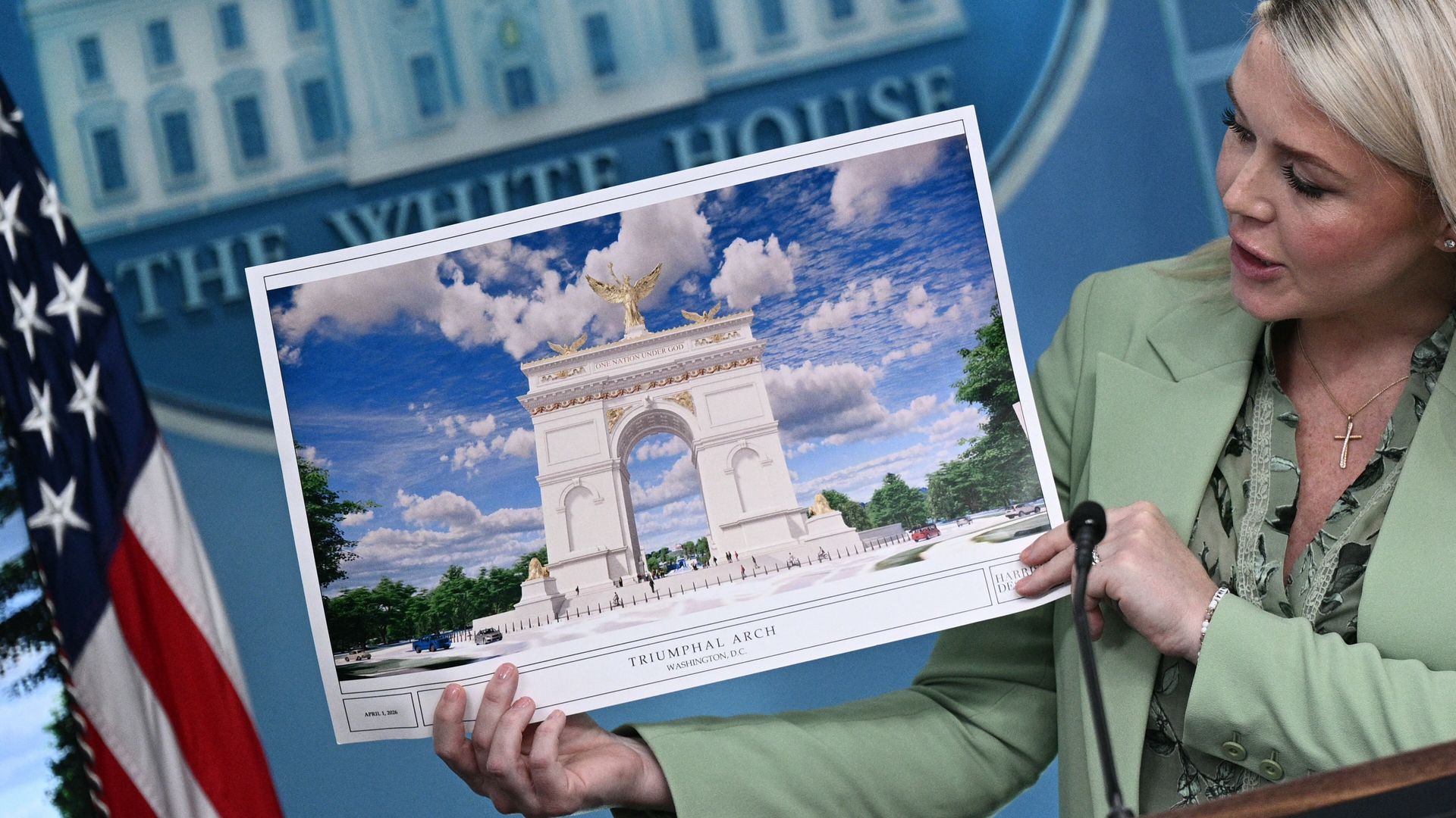 White House Press Secretary Karoline Leavitt shows an artist's rendering of US President Donald Trump's planned Triumphal Arch during a press briefing in the Brady Briefing Room at the White House in Washington, DC, on April 15, 2026. (Photo by Brendan SMIALOWSKI / AFP via Getty Images)