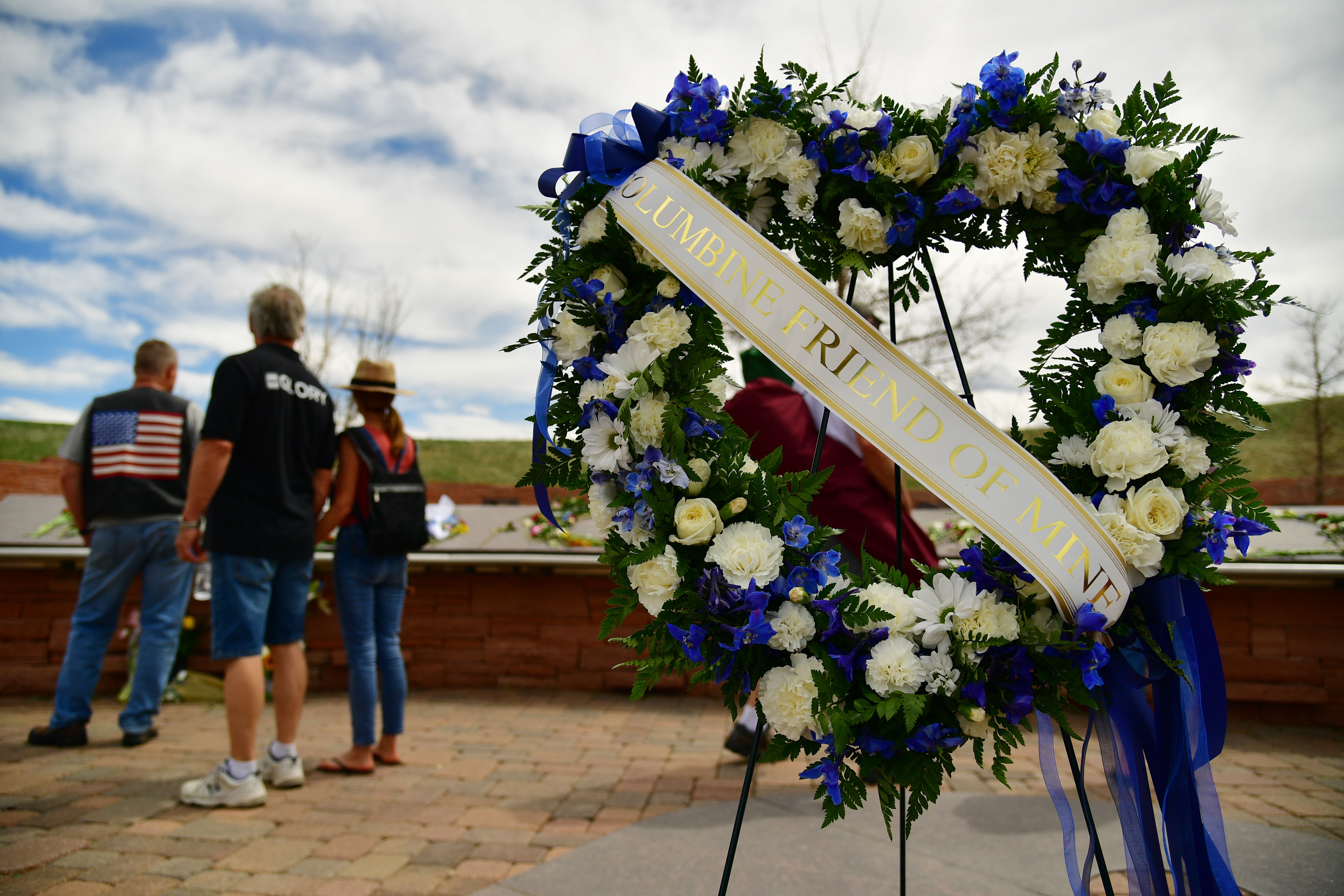 Flowers are placed at the "Columbine: 20 years" event  in honor of those impacted by the massacre.