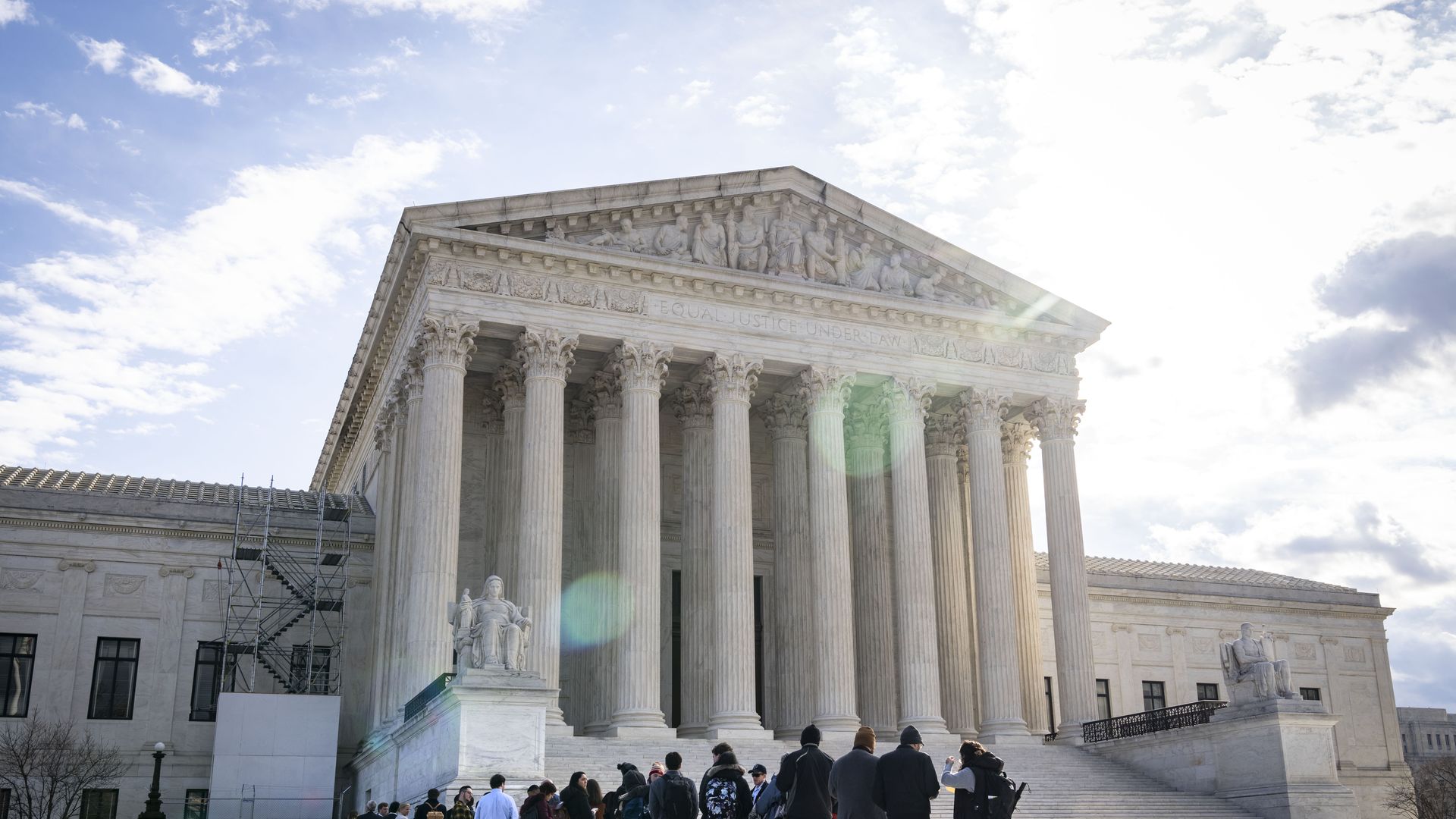 People gather in front of the U.S. Supreme Court