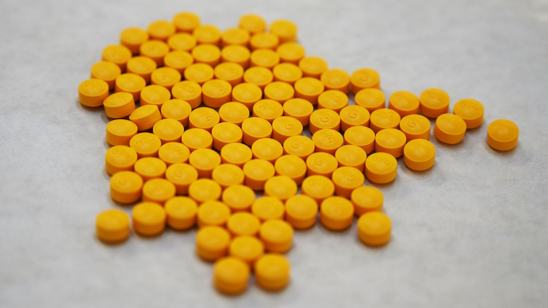 Tablets believed to be laced with fentanyl are displayed at the Drug Enforcement Administration Northeast Regional Laboratory