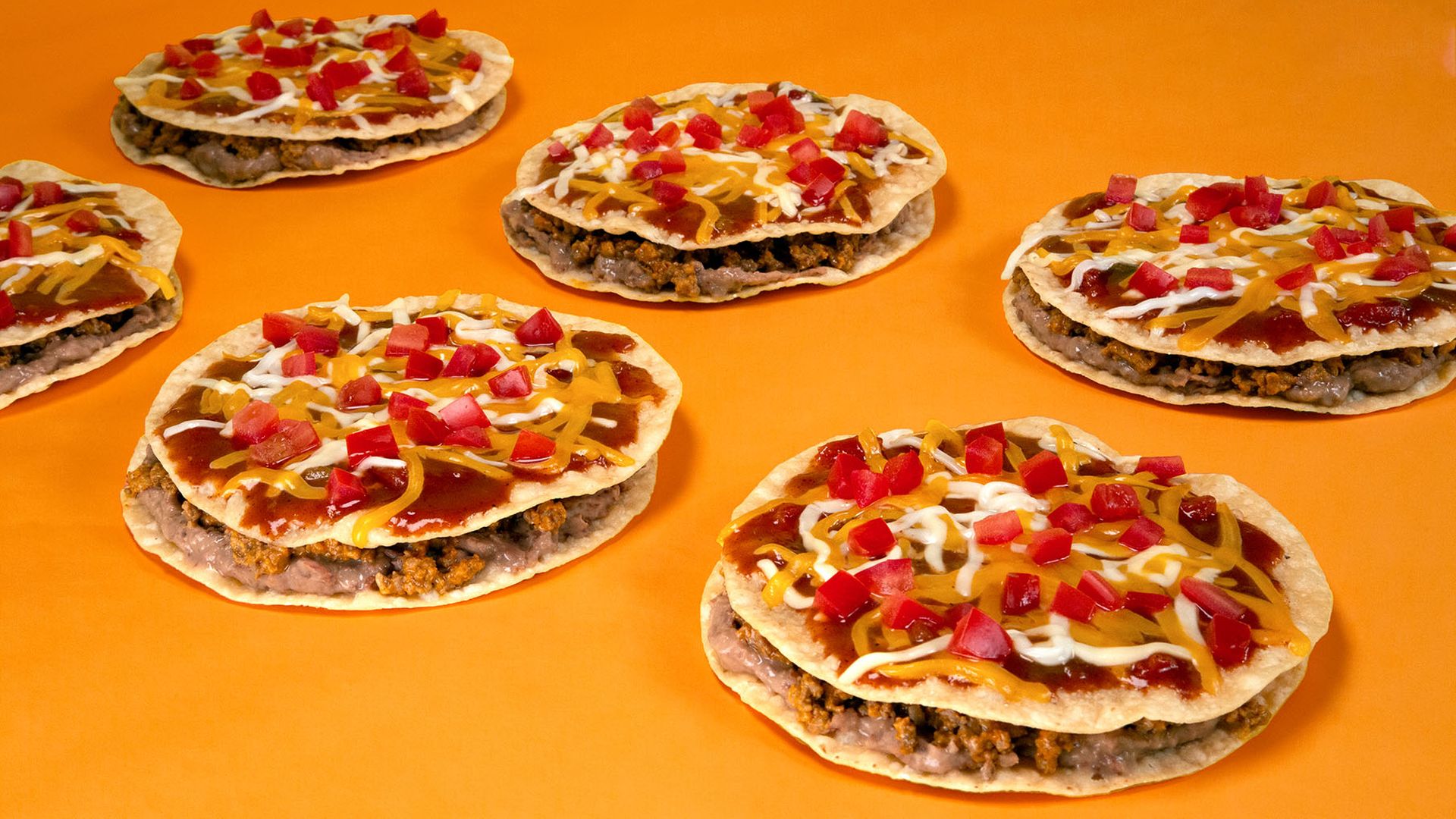 Taco Bell Mexican Pizzas on orange background
