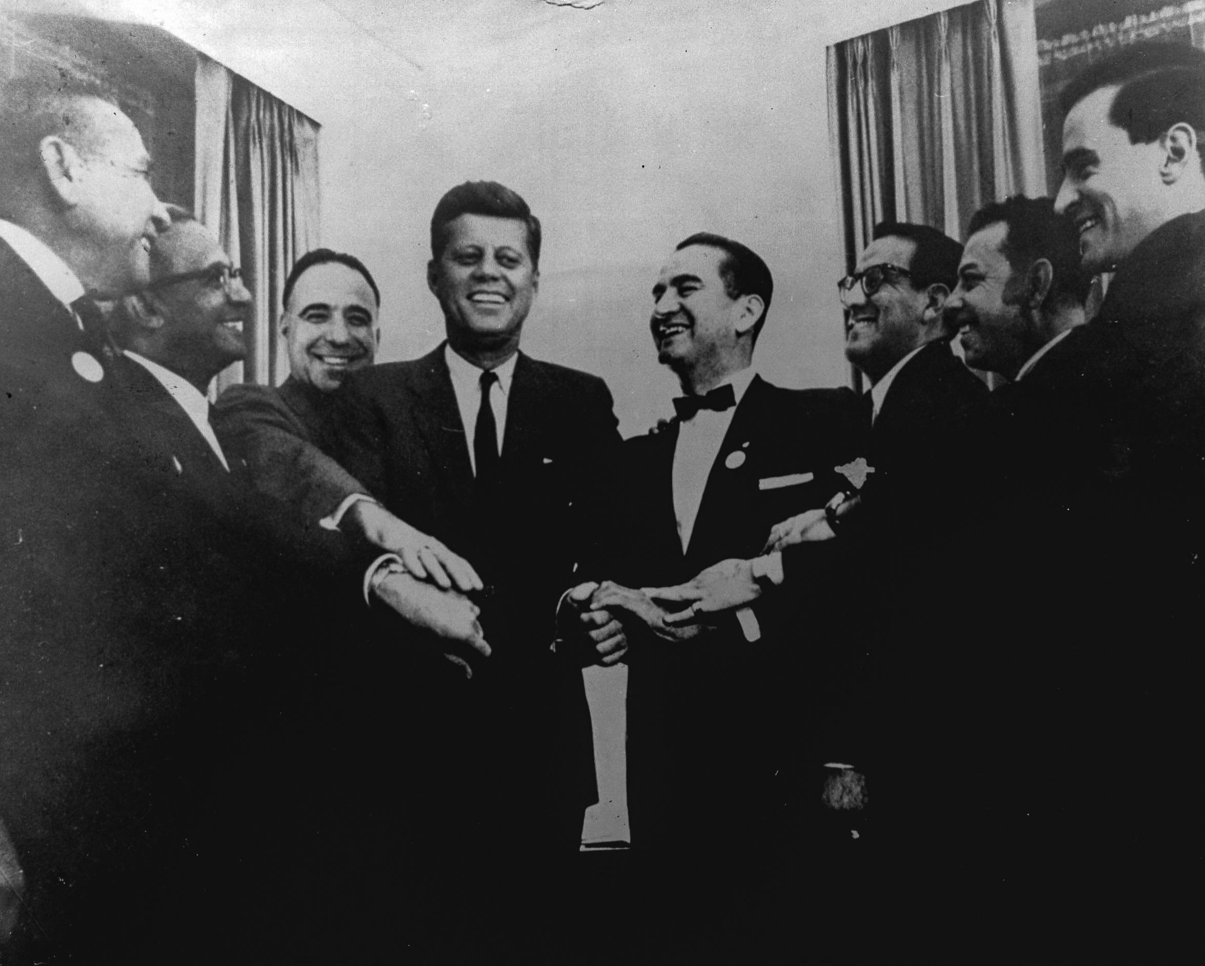 John F. Kennedy poses with Dr. Hector P. Garcia and other Mexican American leaders of Viva Kennedy clubs. The clubs helped Kennedy win 85 to 90% of the national Latino vote in the 1960 presidential election.
