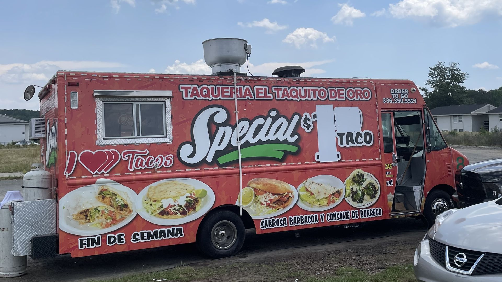 A taco truck that has covered up its $1.50 special price due to inflation.