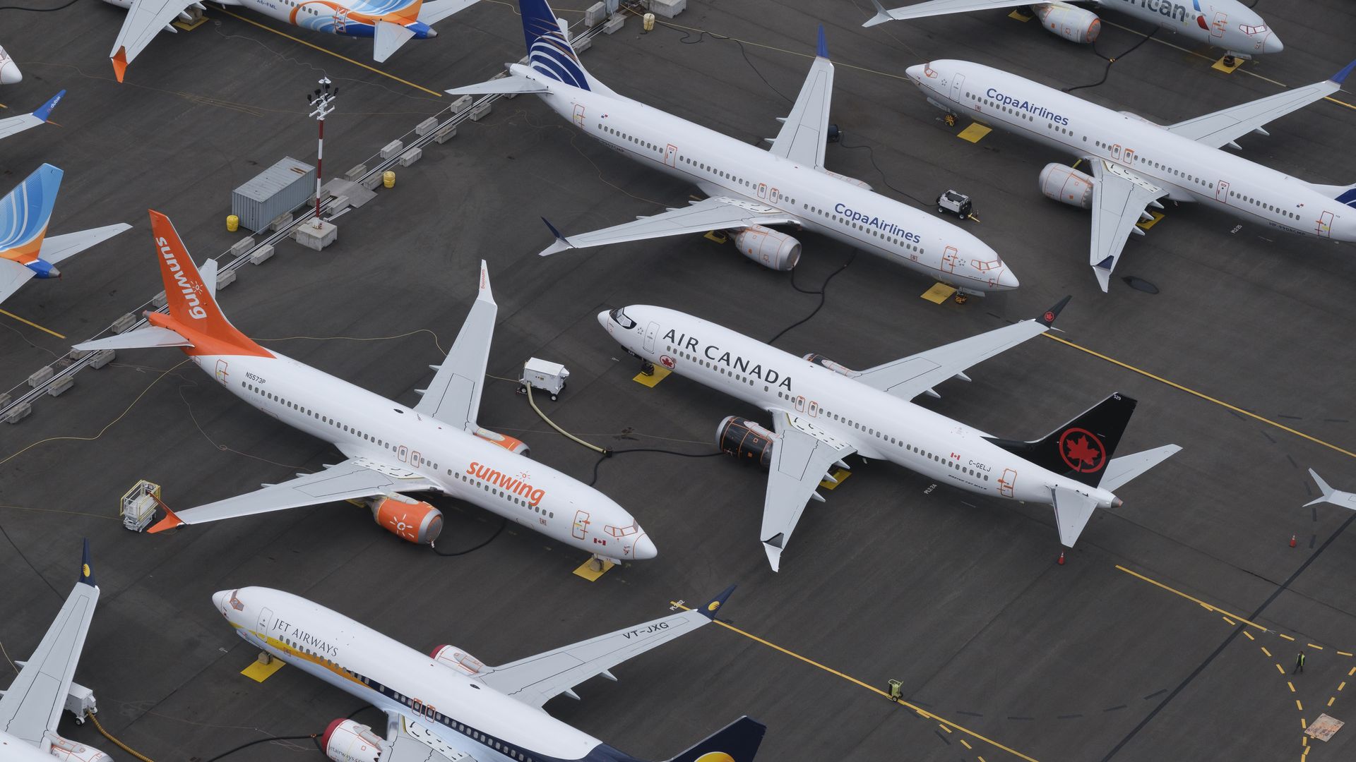 Boeing 737 MAX airplanes are stored in a parking lot