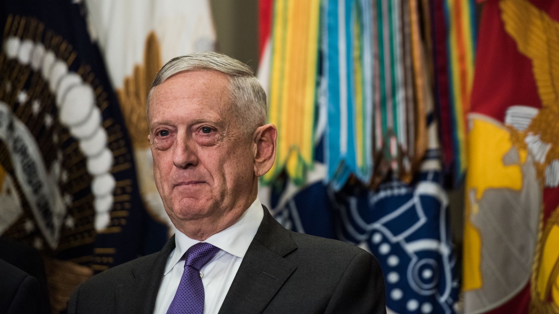 Defense Secretary James Mattis in front of flags in the White House