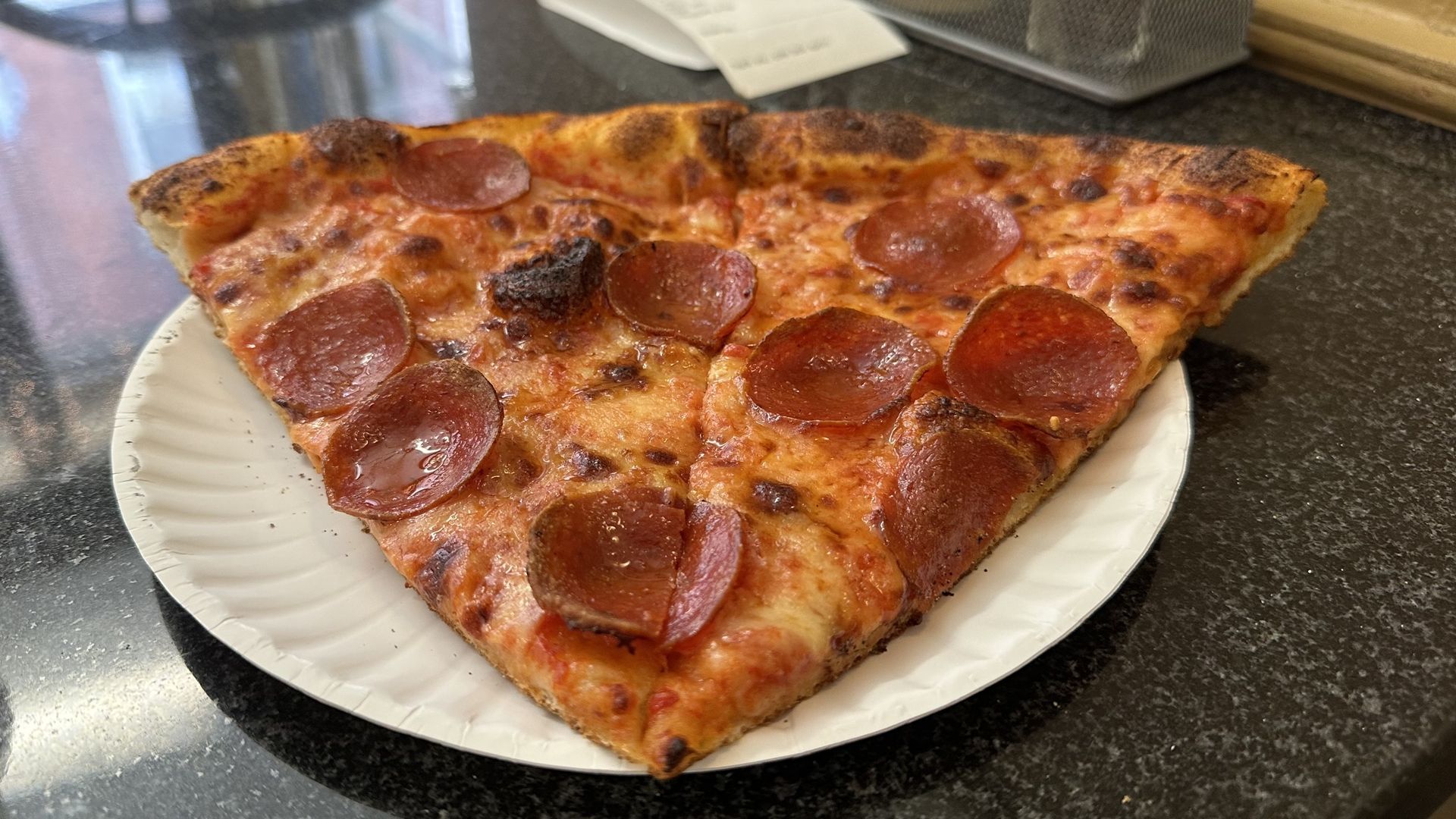 Two slices of pepperoni pizza. 