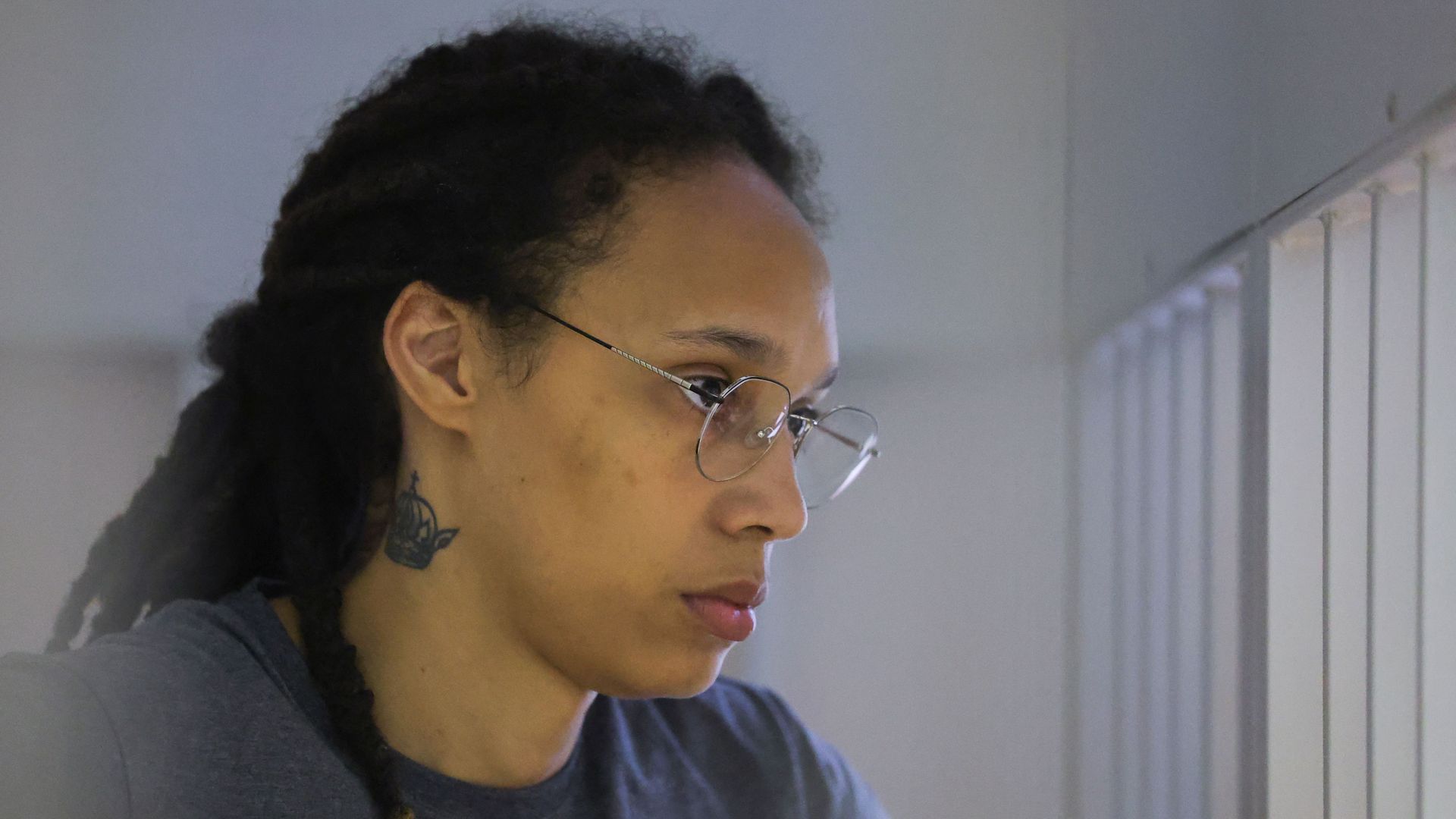 Brittney Griner inside a defendants' cage during a court hearing in Khimki, Russia, on Aug. 4.
