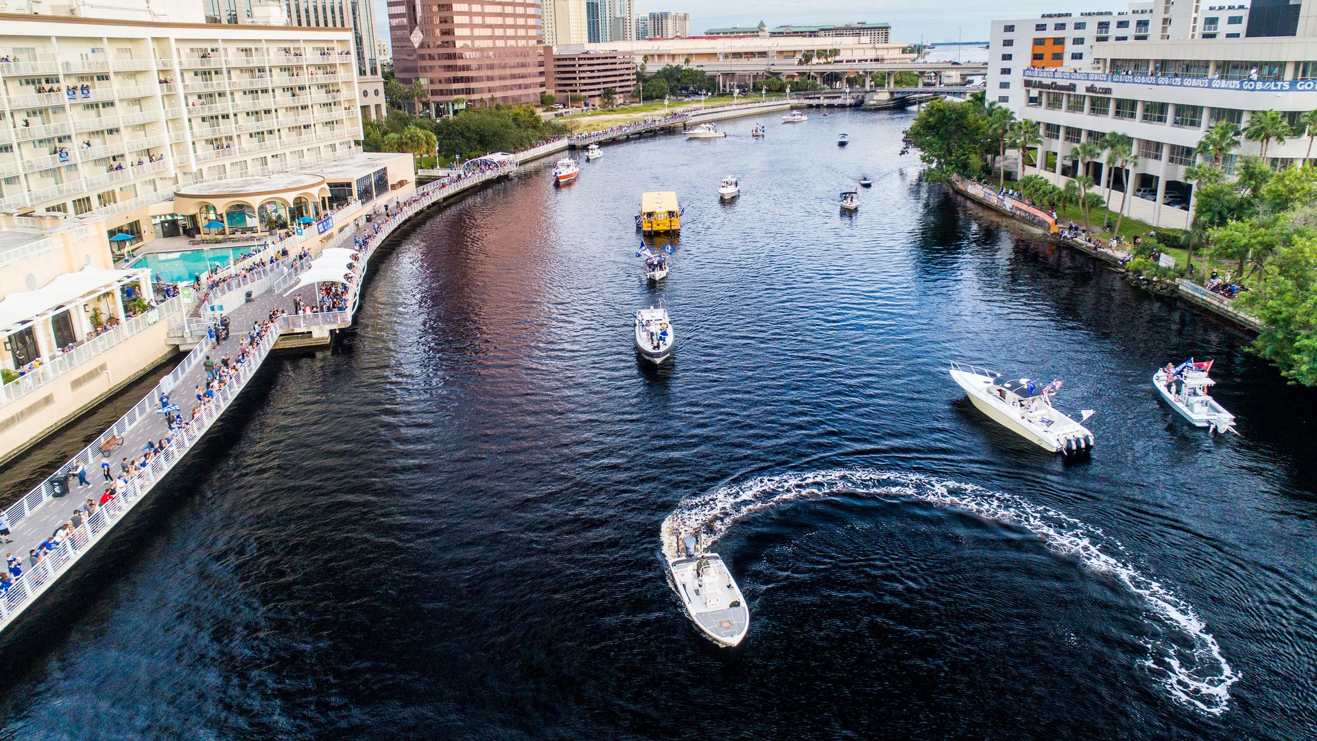 A boat circles back on the Hillsborough River.