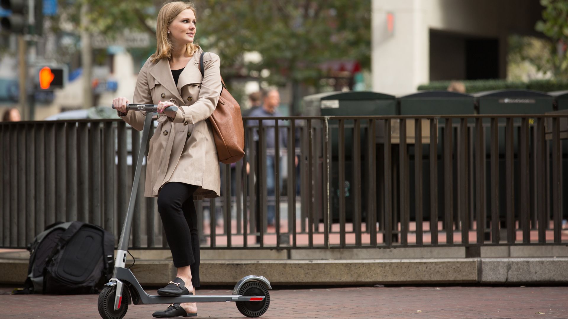 woman riding scooter