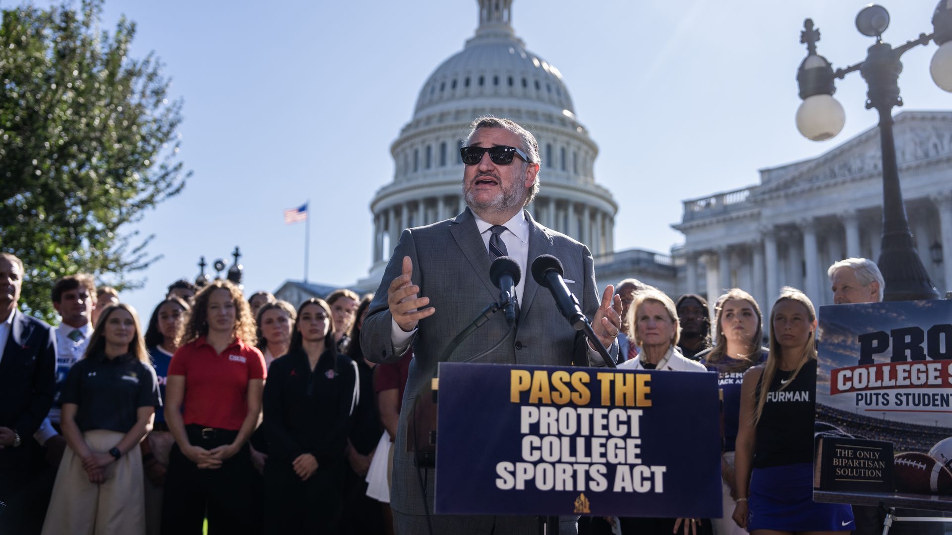 Sen. Ted Cruz speaks in front of a podium that says "Pass The Protect College Sports Act"