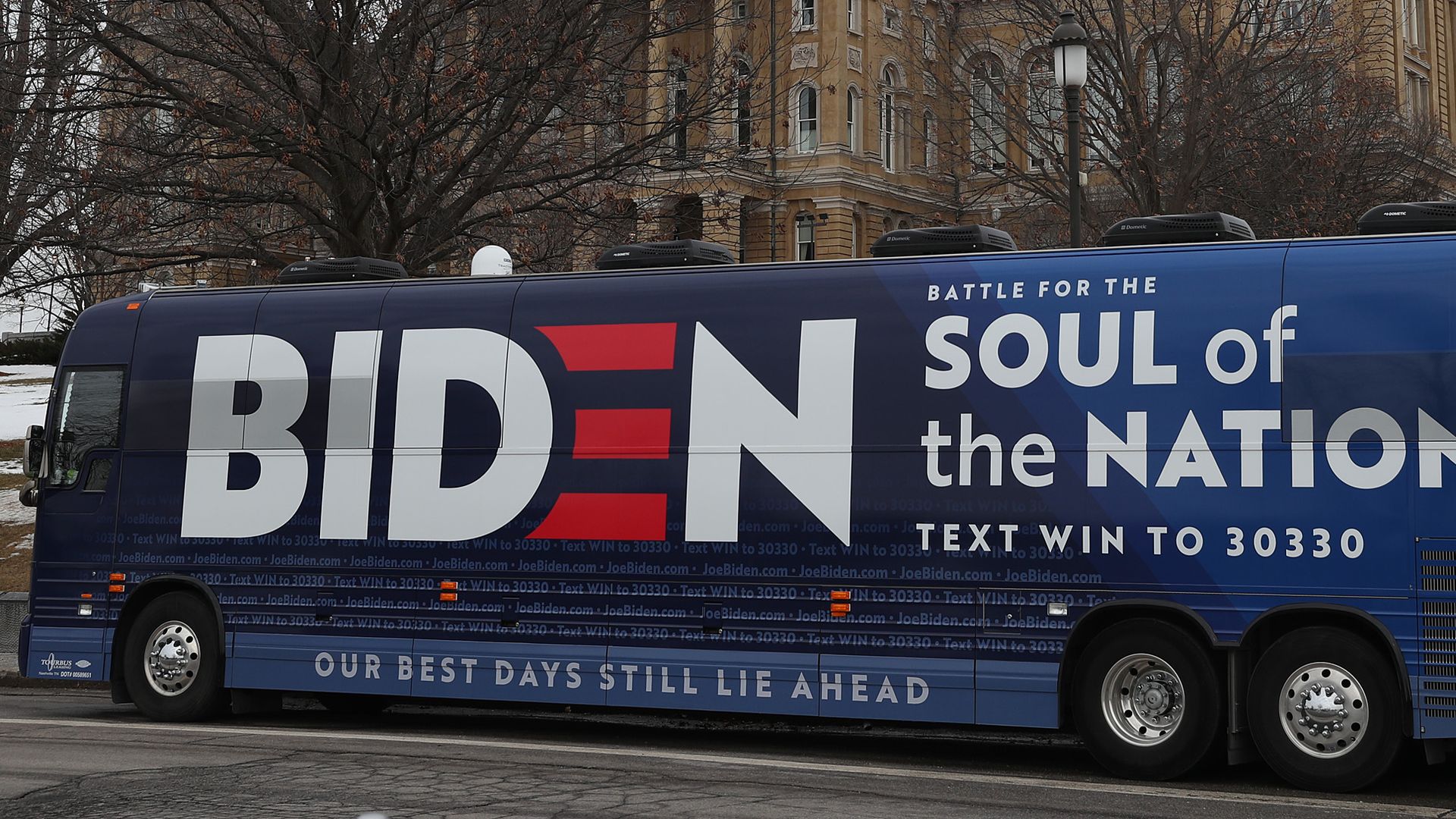 The campaign bus for Democratic presidential candidate former Vice President Joe Biden is seen parked in front of the Iowa State Capitol on February 03, 2020 in Des Moines, Iowa, surrounded by snow.