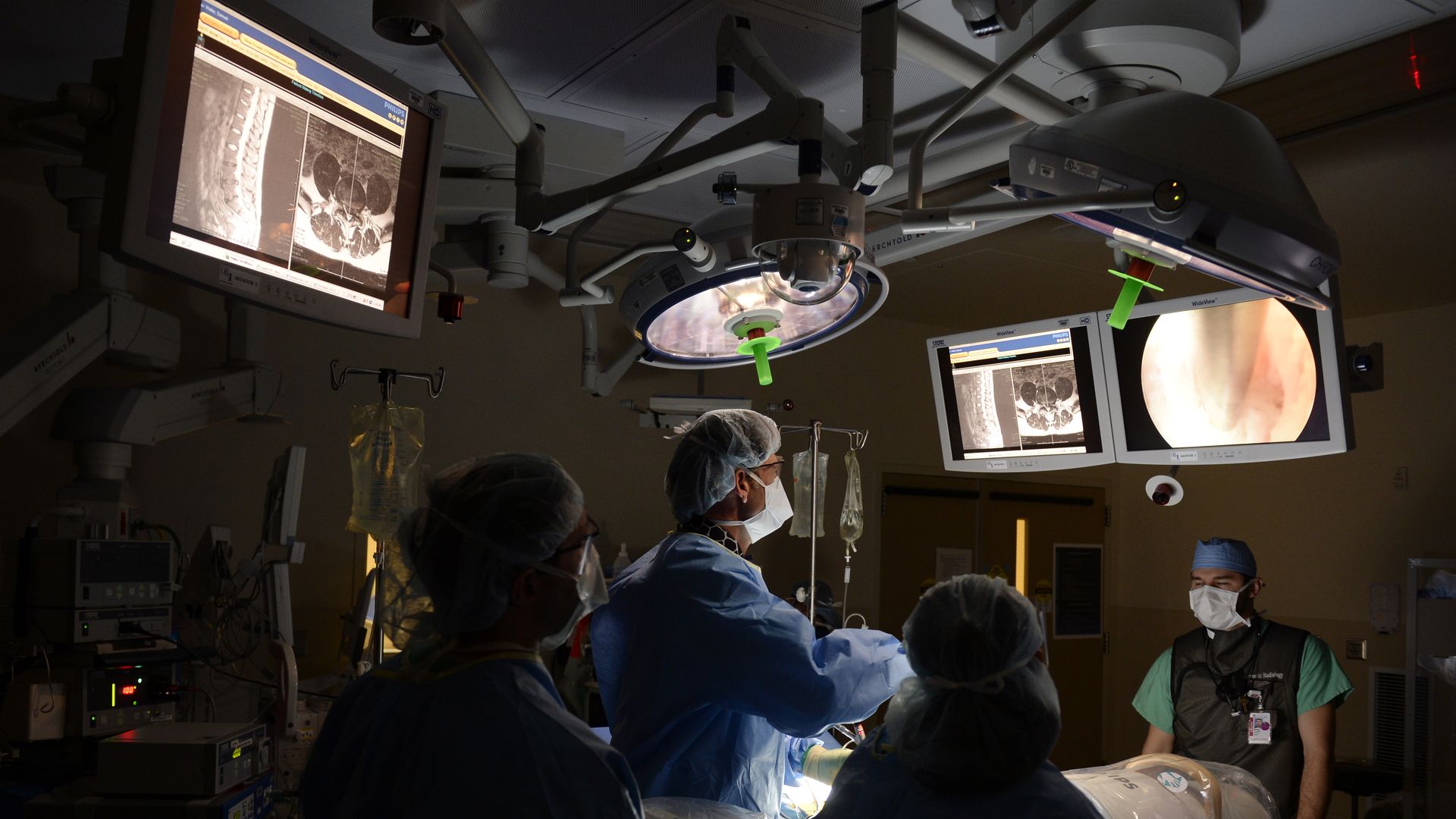 Doctors perform surgery to fix a patient's ruptured disc.