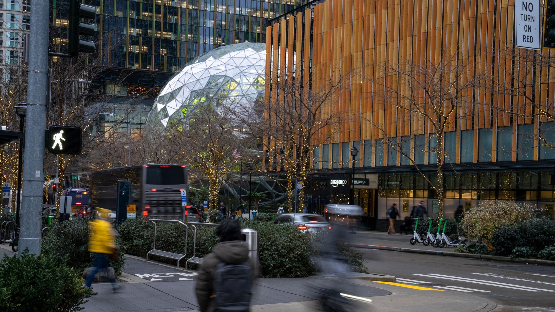 A person walks near Amazon headquarters in the South Lake Union neighborhood of Seattle.