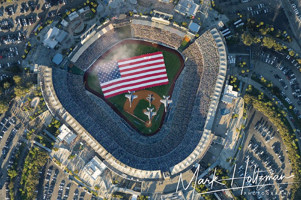 A fleet of four Navy fighter jets fly over Dodger Stadium as Brad Paisley performs the National Anthem before Game 1 of the World Series on Friday.