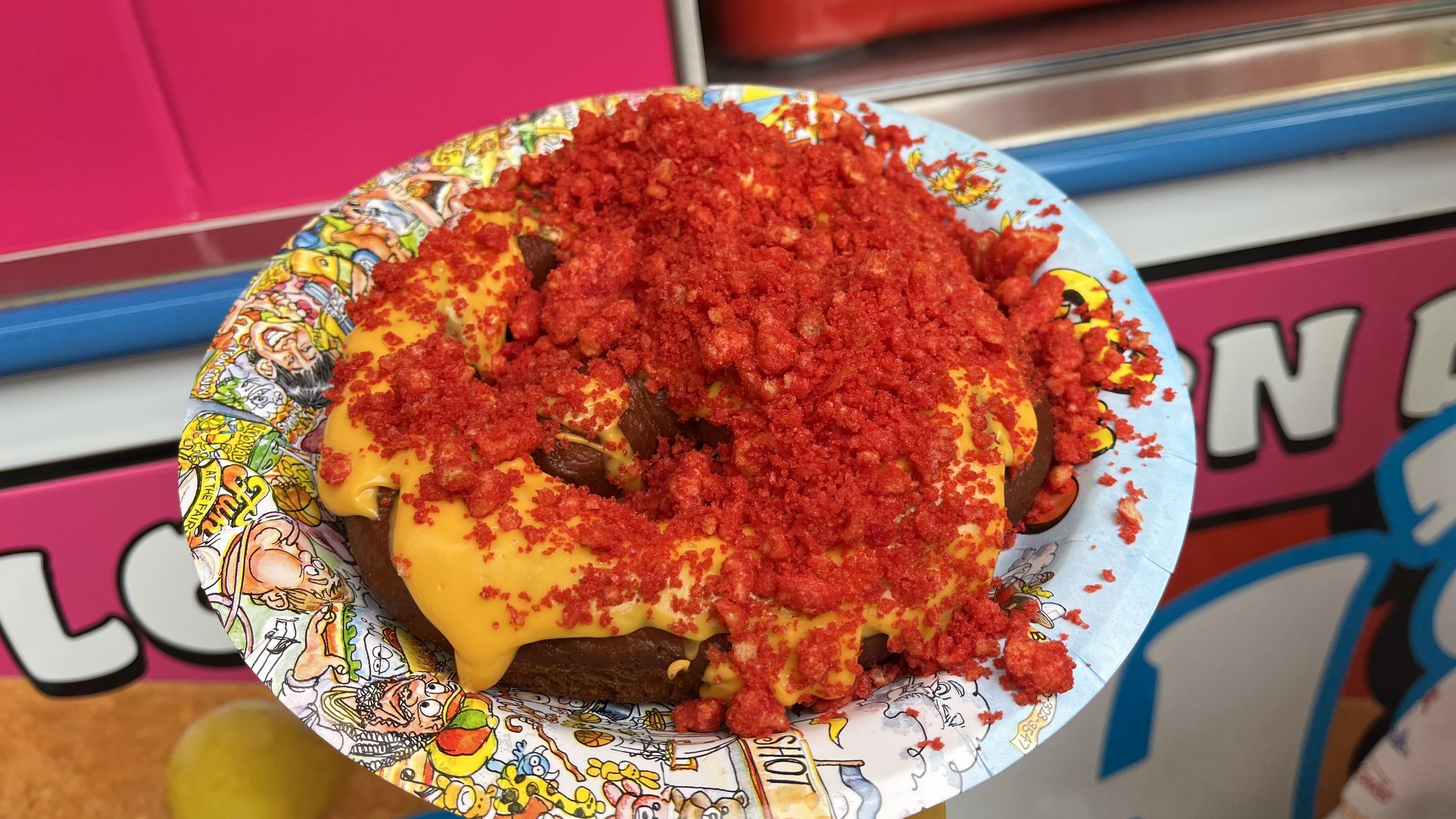 Hot cheeto pretzel on a paper plate