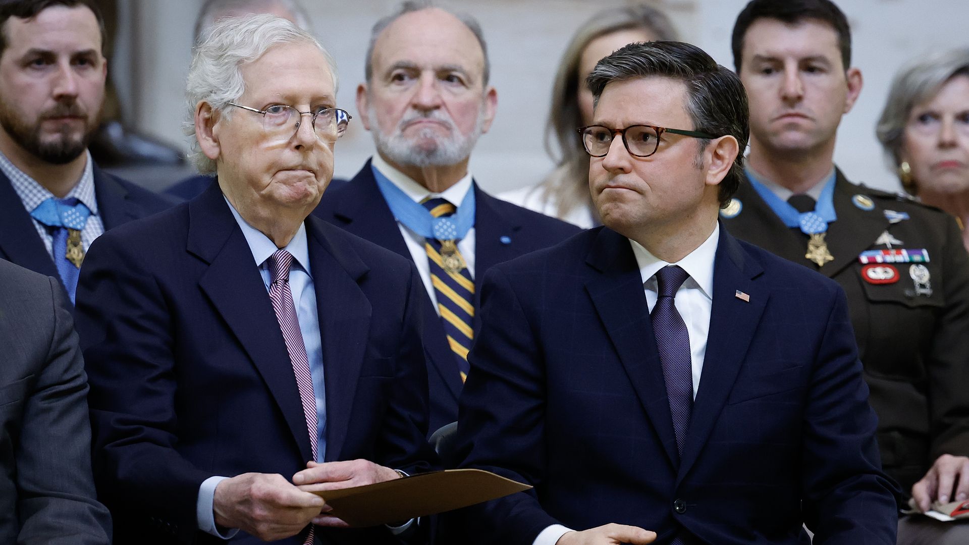 WASHINGTON, DC - APRIL 29: (L-R) Senate Minority Leader Mitch McConnell (R-KY) and U.S. Speaker of the House Mike Johnson (R-LA) attend a congressional tribute in the rotunda of the U.S. Capitol for retired Army Col. Ralph Puckett Jr. on April 29, 2024 in Washington, DC. One of the U.S. Army's most 