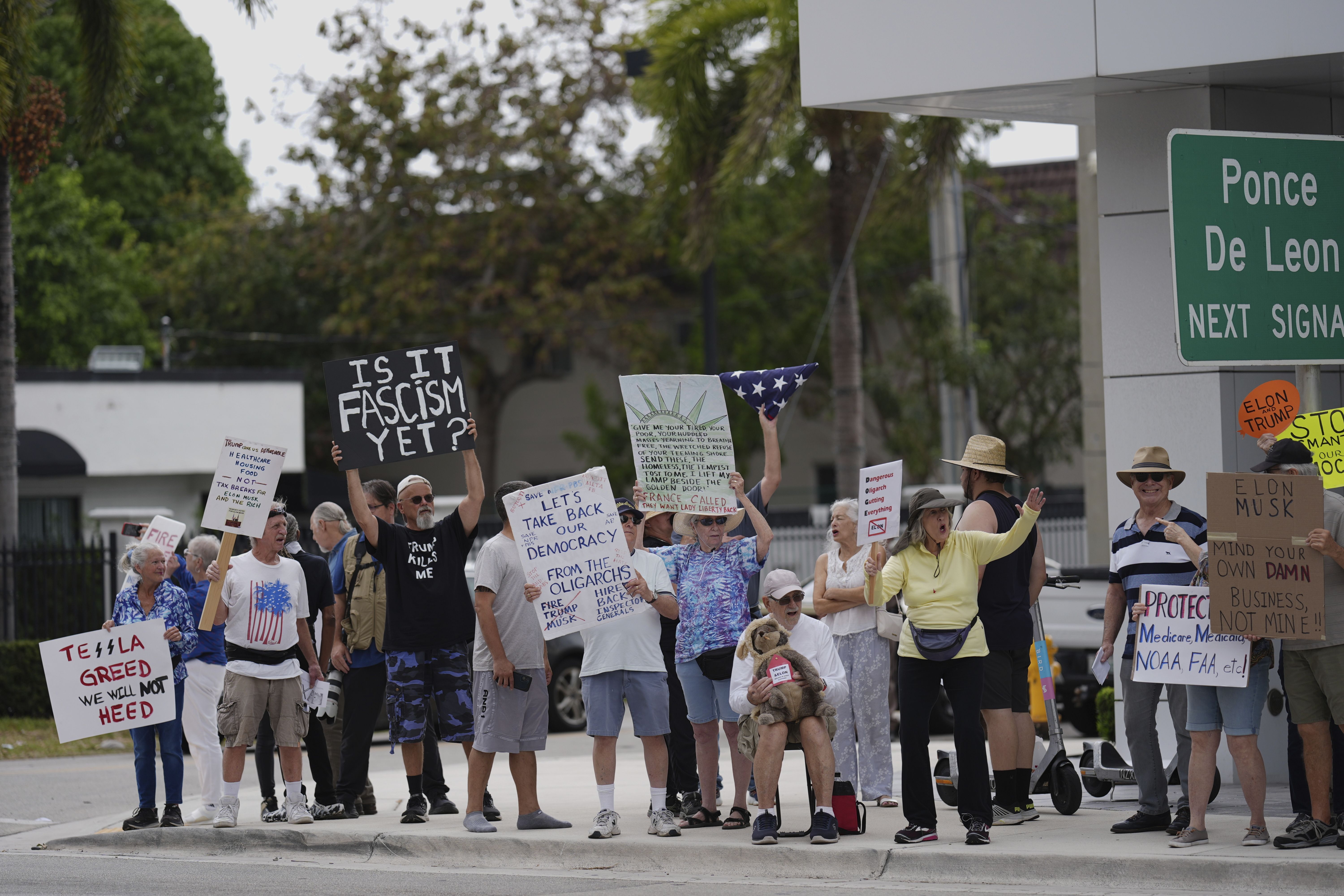 Protesters outside Tesla showroom in Miami
