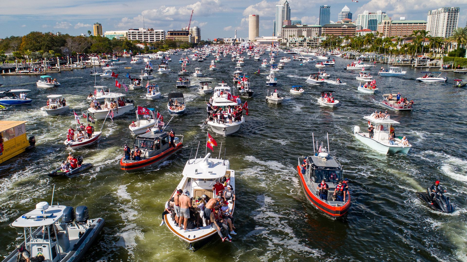 Picture of Super Bowl Victory Boat Parade, with multiple boats on the river