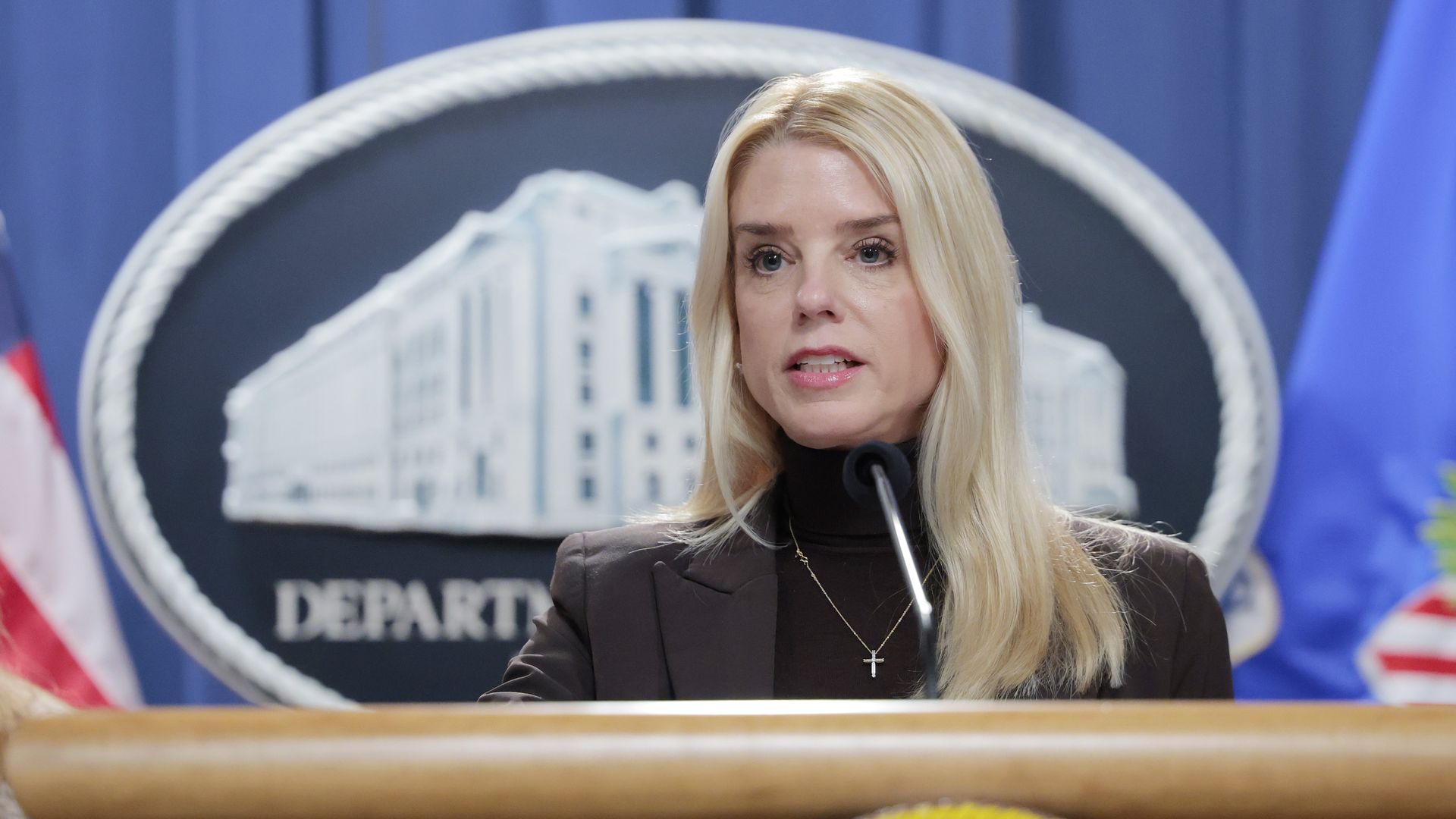 Attorney General Pam Bondi speaks at a podium.