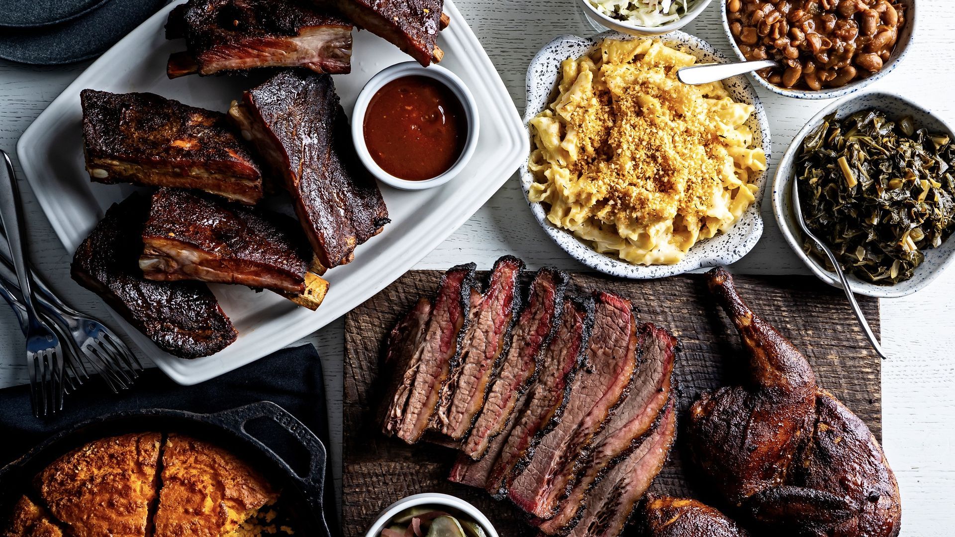 A plate of ribs and mac n cheese.