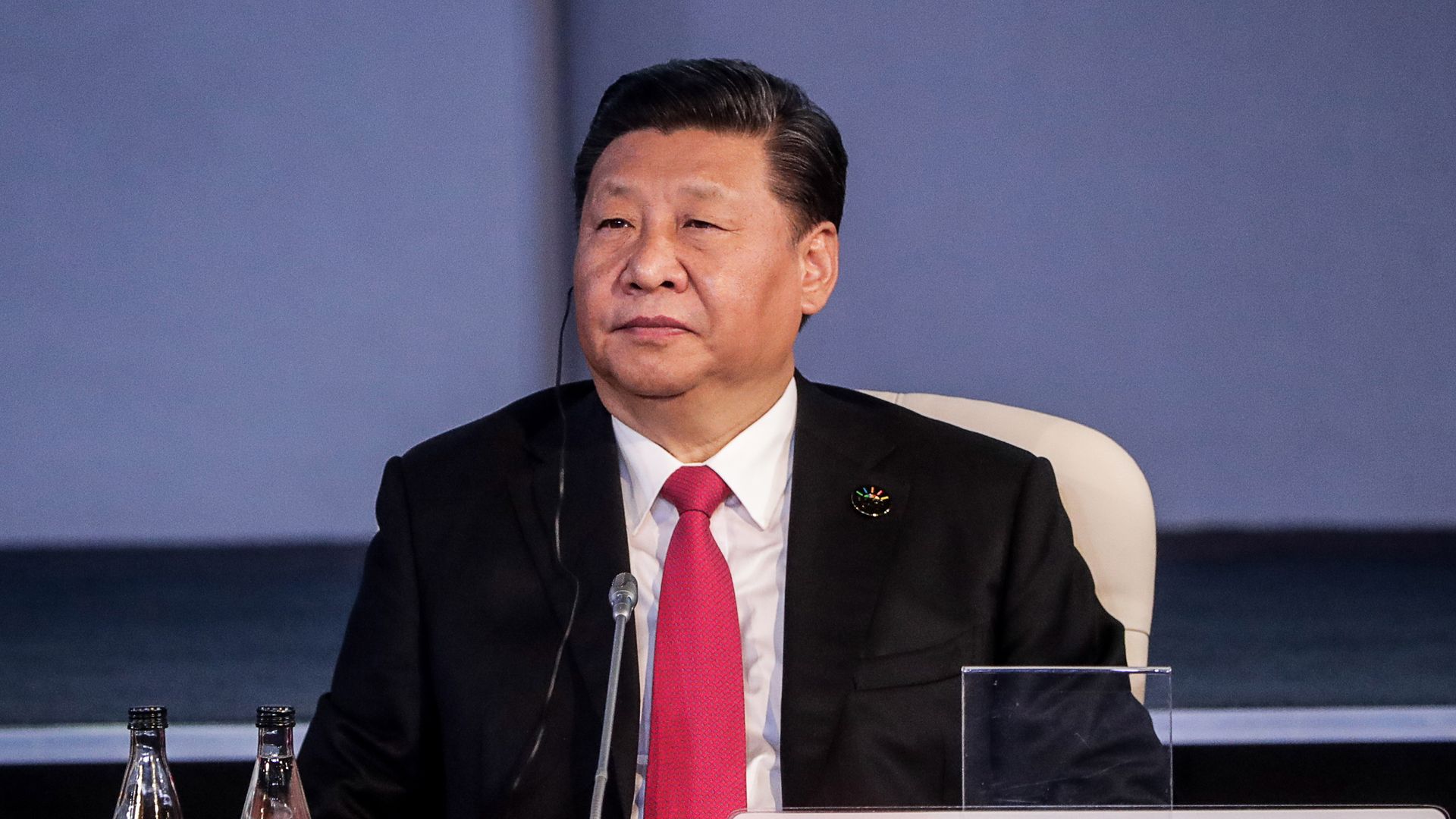 Photo of Chinese President Xi sitting at a table at the BRICS conference