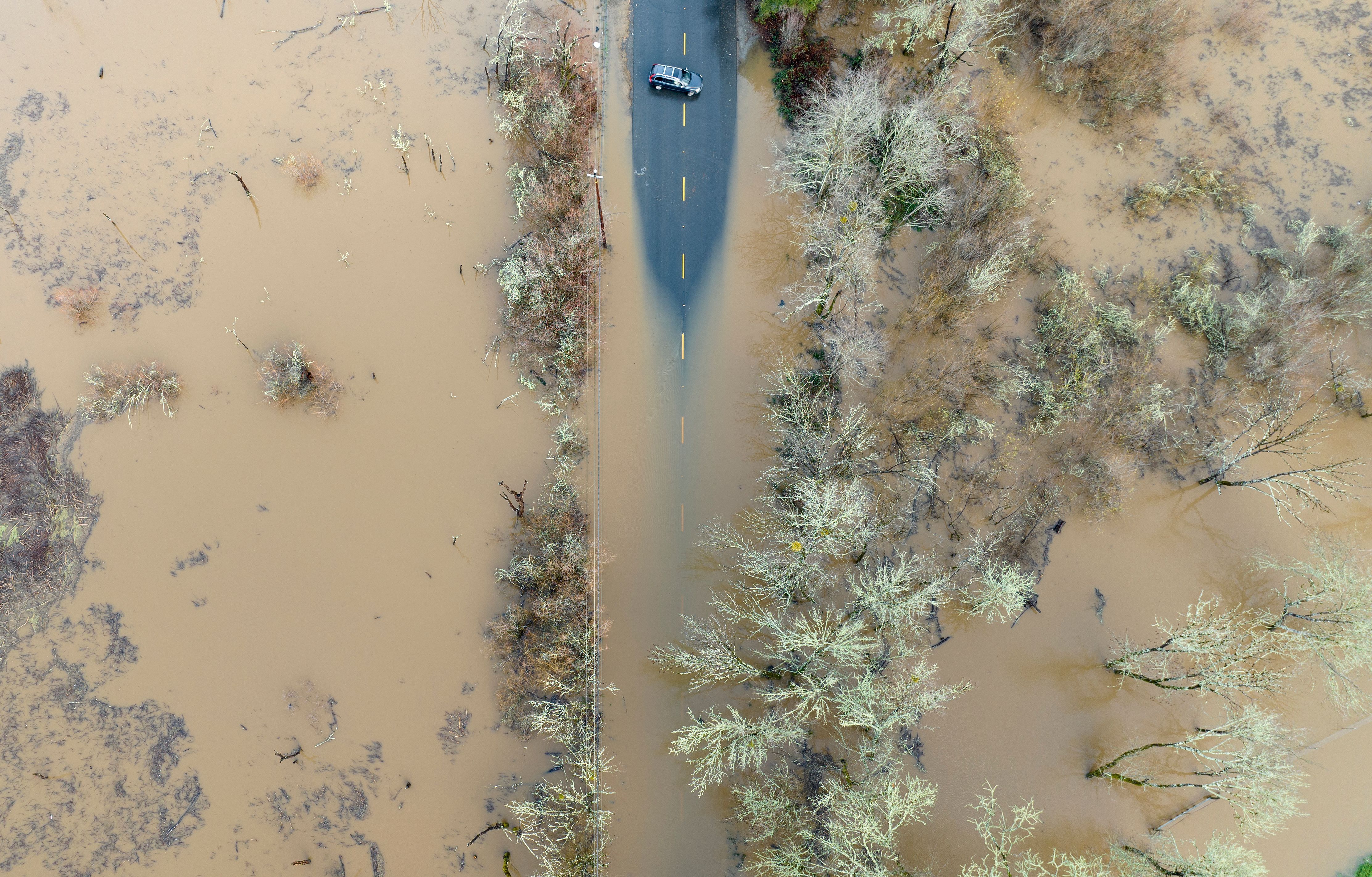  A vehicle turns around on a flooded road in Sebastopol, California, on January 05.