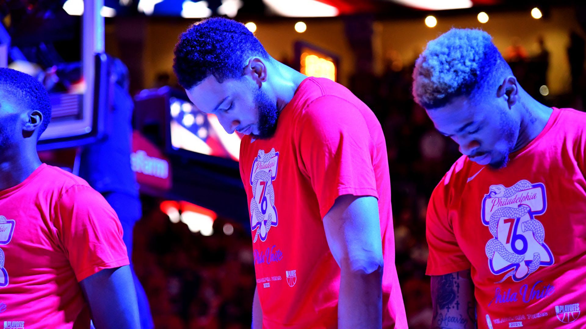 Ben Simmons bows his head on the court.