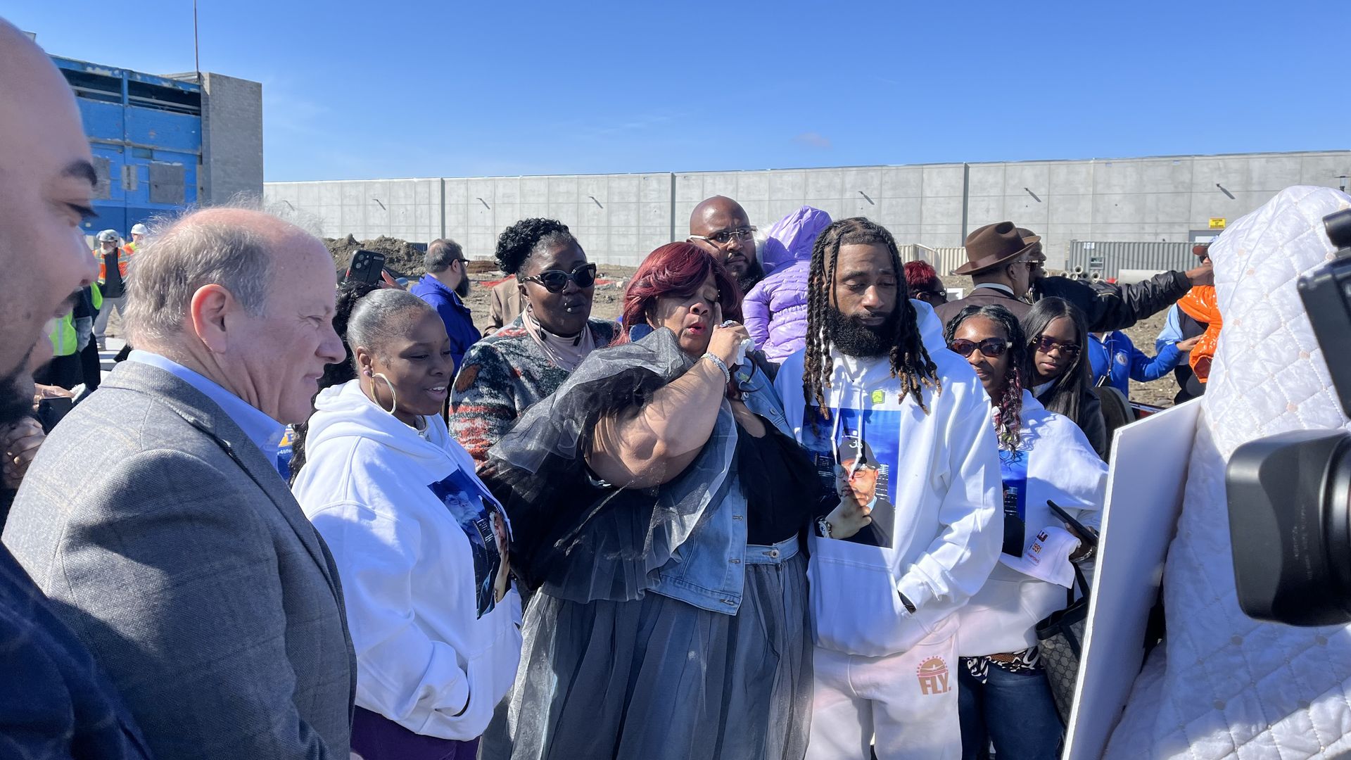 Desha Hargrove, center, gets emotional at the Jason Hargrove Transit Center dedication ceremony.
