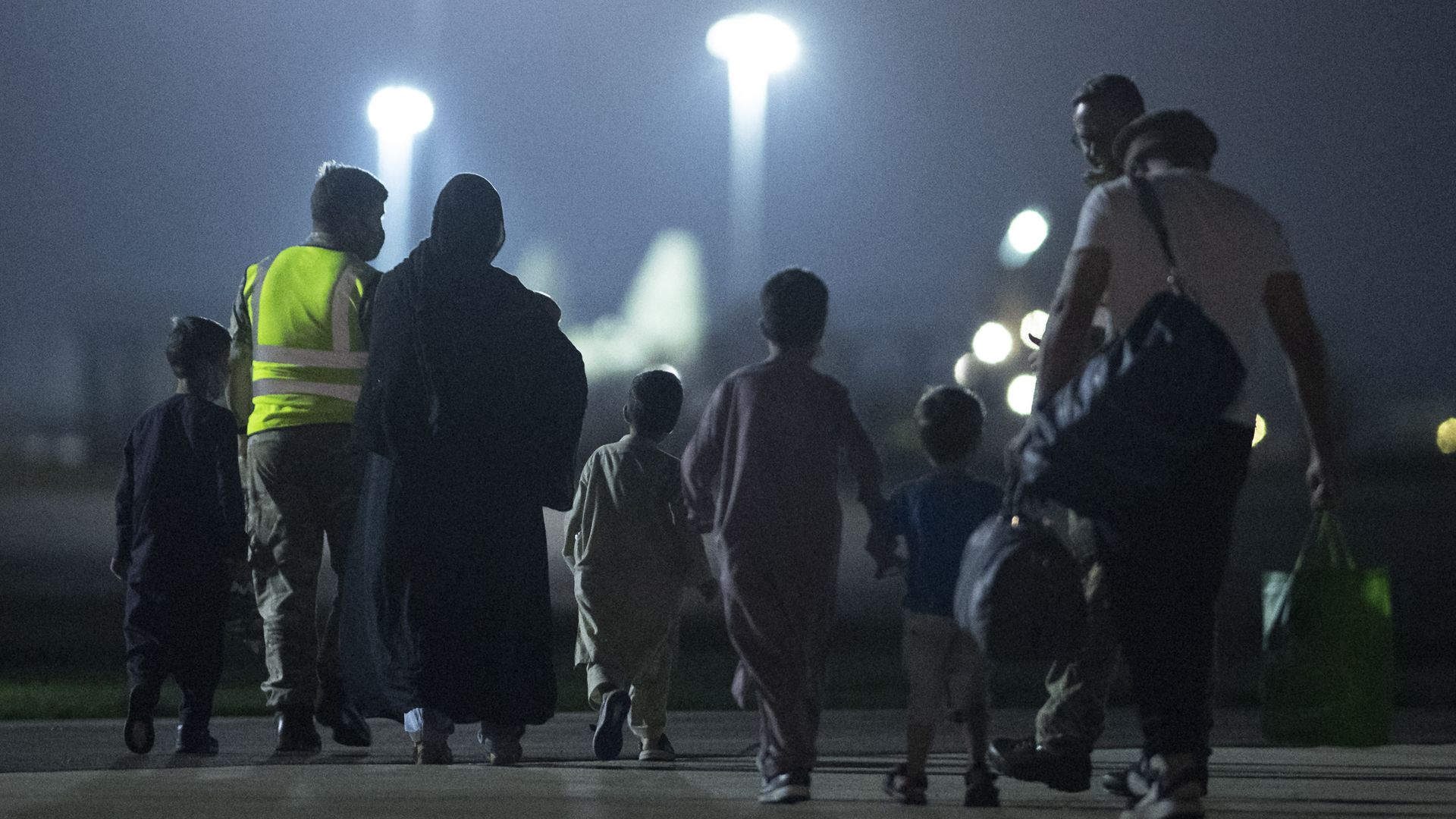  Passengers evacuated from Afghanistan disembark from a British Royal Air Force (RAF) Airbus KC2 Voyager aircraft, after landing at RAF Brize Norton station in southern England on August 24