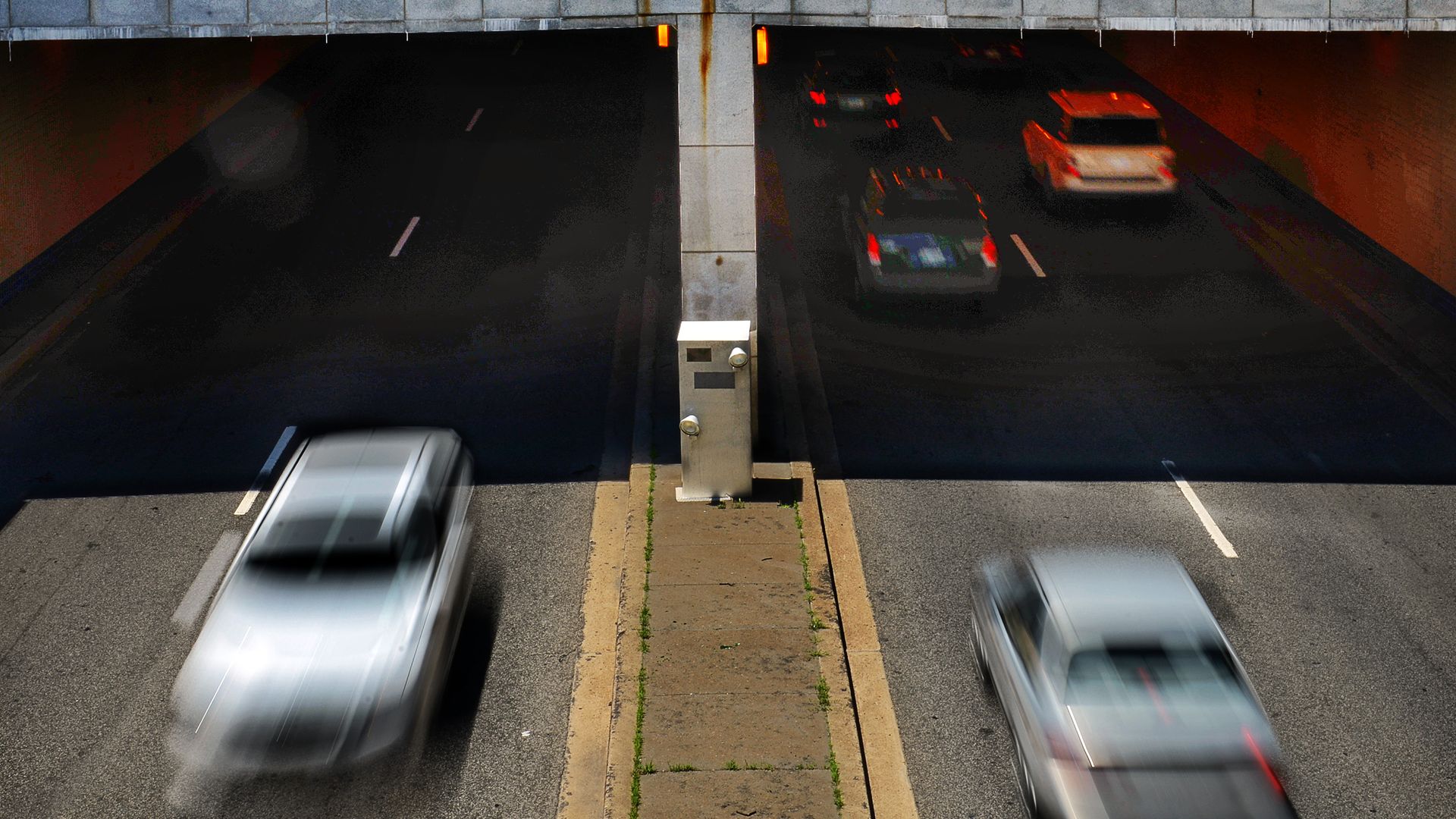 A speed camera posted at an underpass