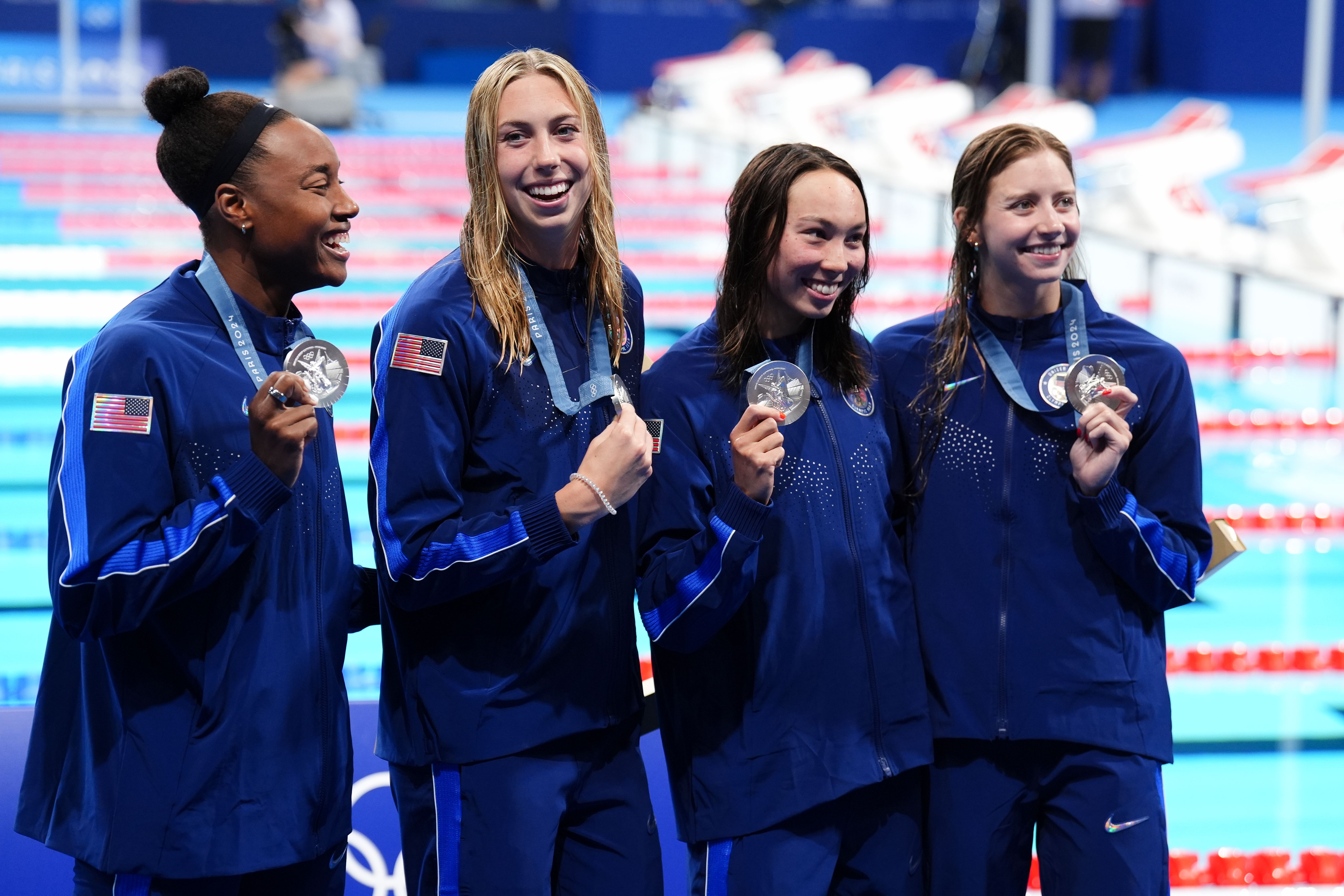 Team USA celebrate with their silver medals after finishing second in the Women's 4 x 100m Freestyle Relay Final at the Paris La Defense Arena on the first day of the 2024 Paris Olympic Games in France. Picture date: Saturday July 27, 2024. 