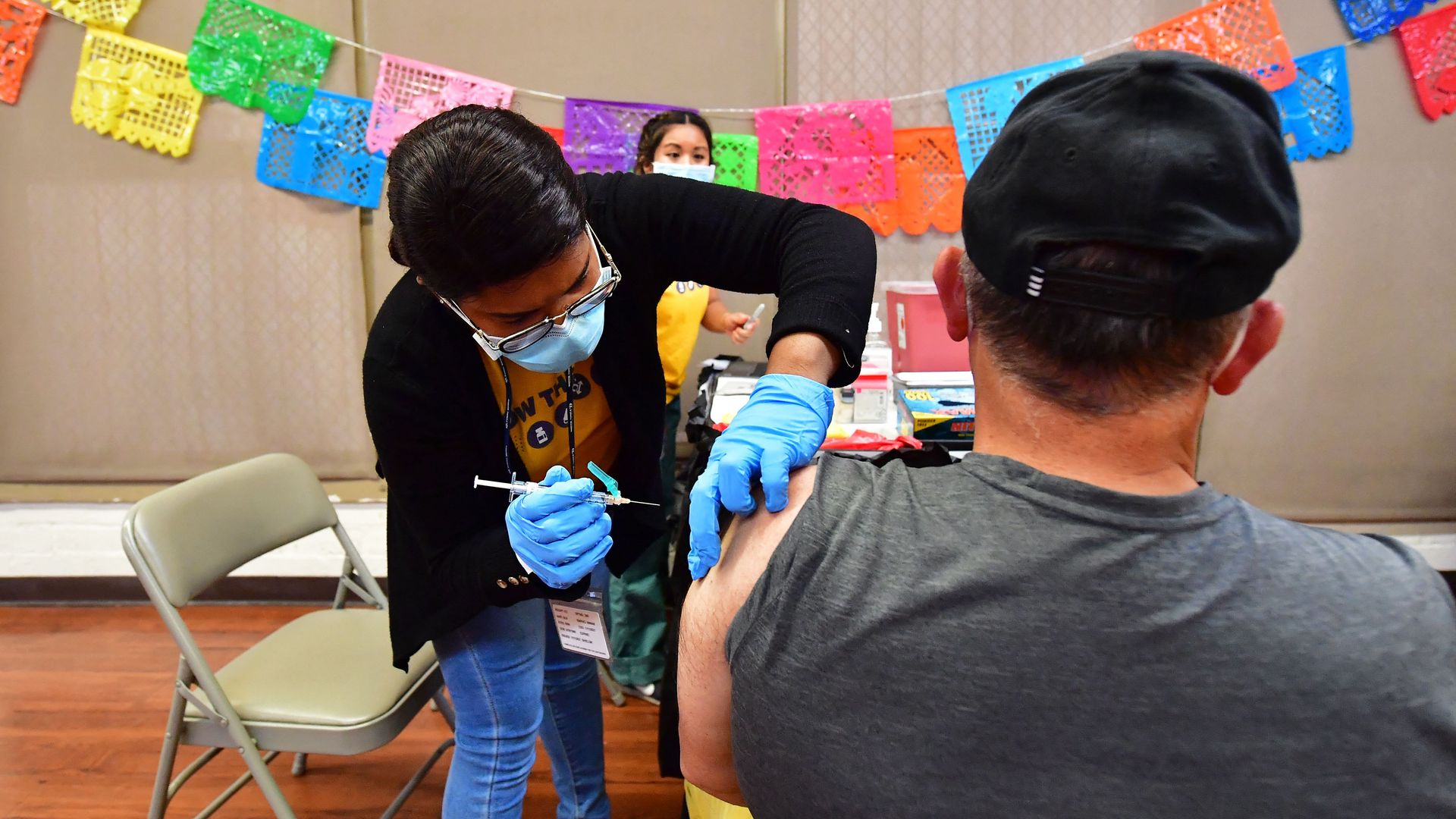 Person administering a COVID shot