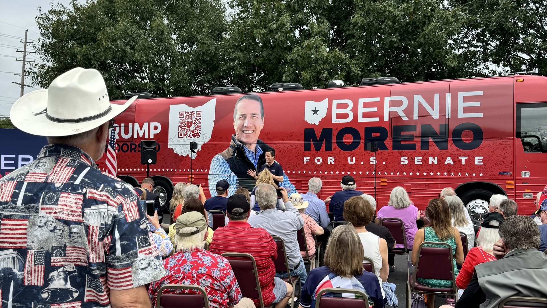 Bernie Moreno giving a stump speech outside of his red campaign bus