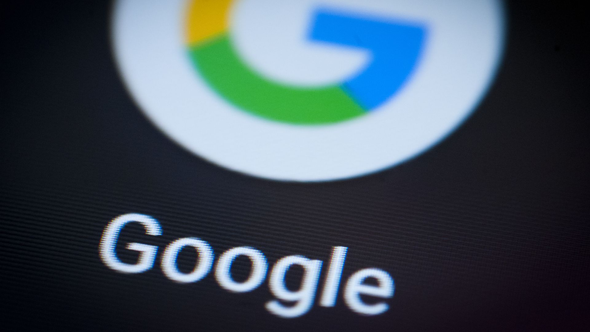 A photo of the Google app icon displayed on a smartphone.