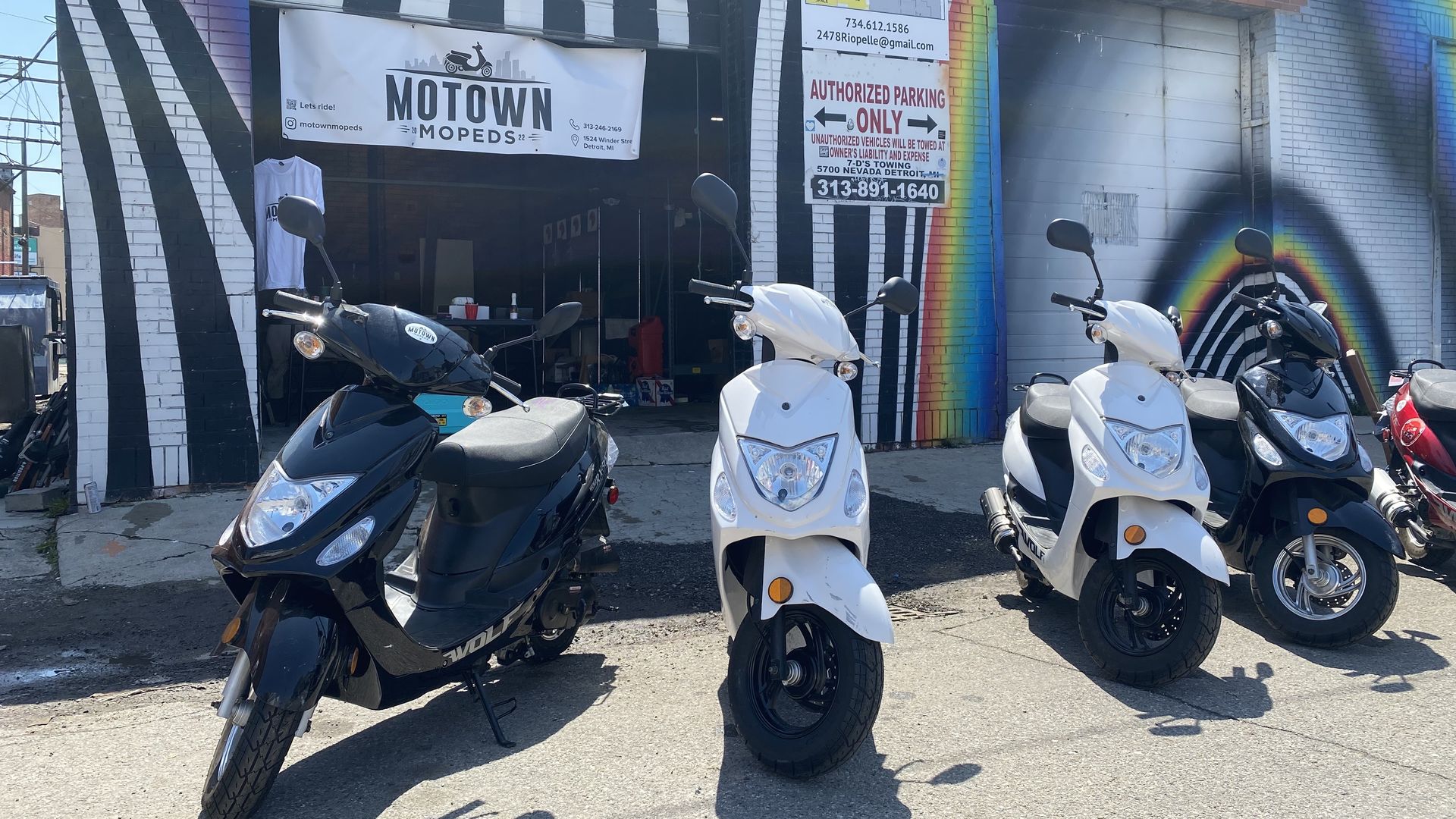 Mopeds sit outside the Motown Mopeds shop in Eastern Market. 