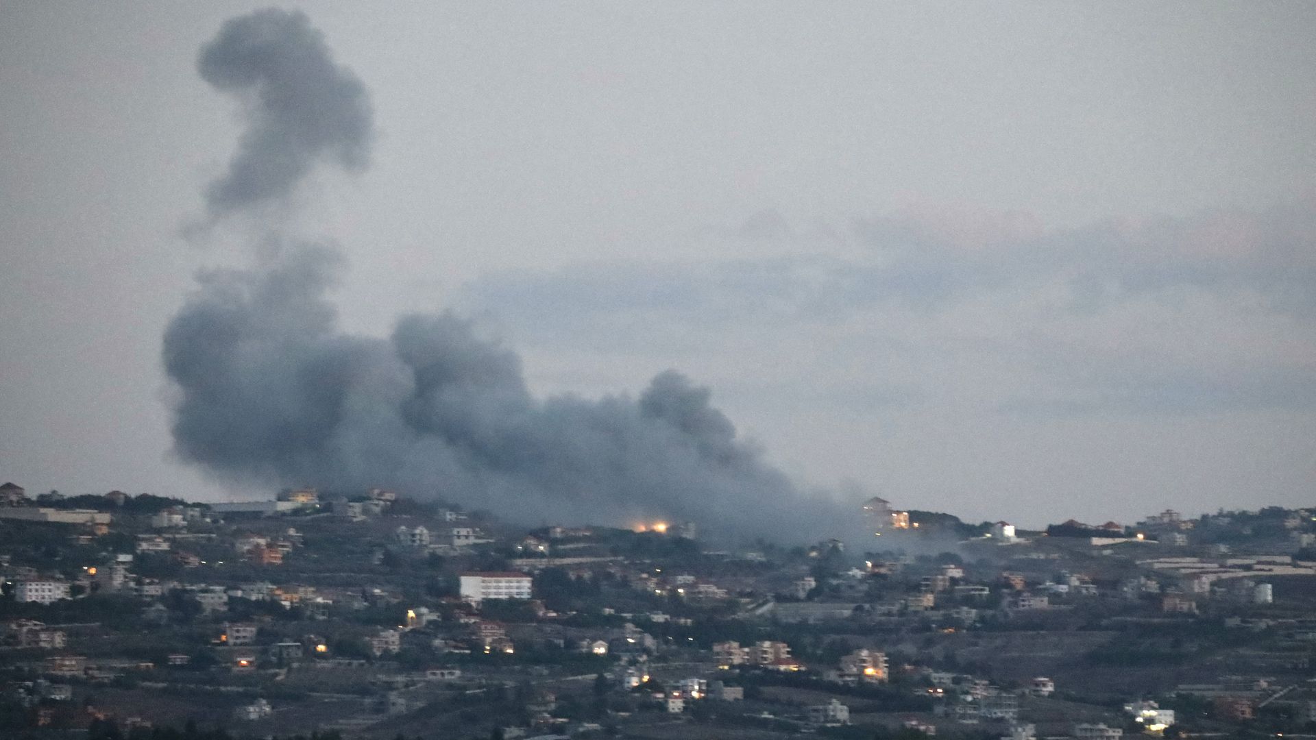 Smoke billows from the site of an Israeli strike on the southern Lebanese village of Taybeh on September 16, 2024, amid ongoing cross-border clashes between Israeli troops and Lebanon's Hezbollah fighters. (Photo by Ammar Ammar / AFP) (Photo by AMMAR AMMAR/AFP via Getty Images)