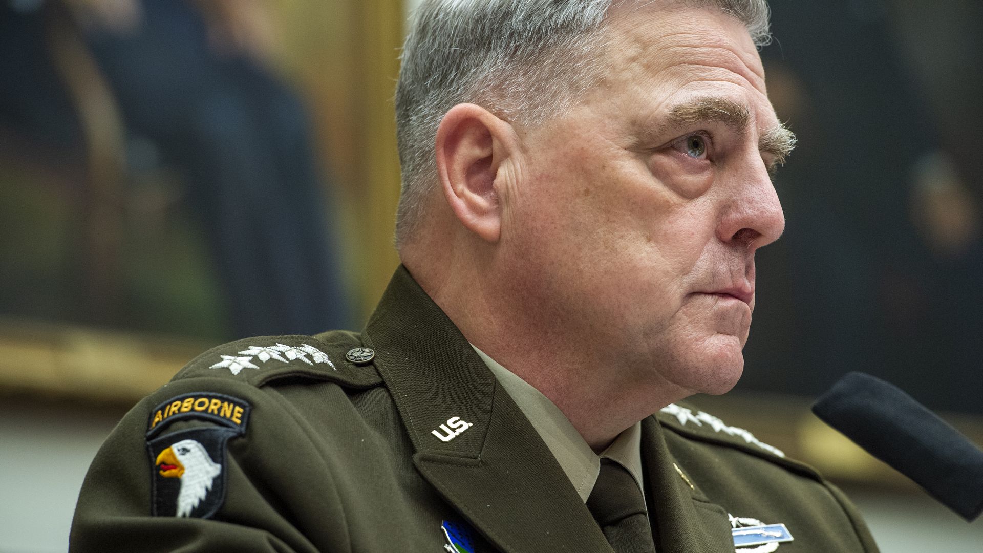 Close-up profile view of Joint Chiefs Chairman Mark Milley in public testimony