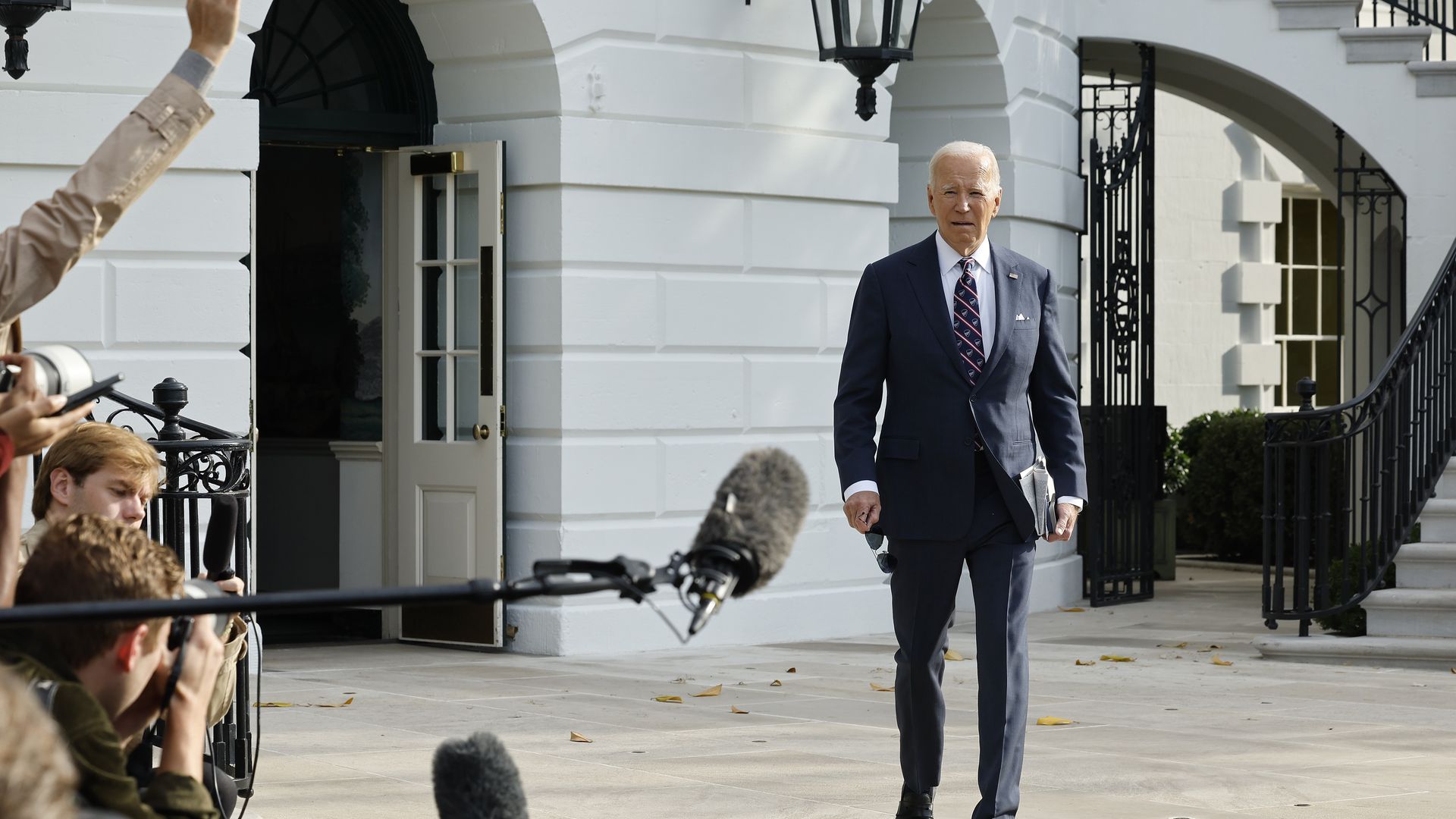 Biden walks toward reporters 