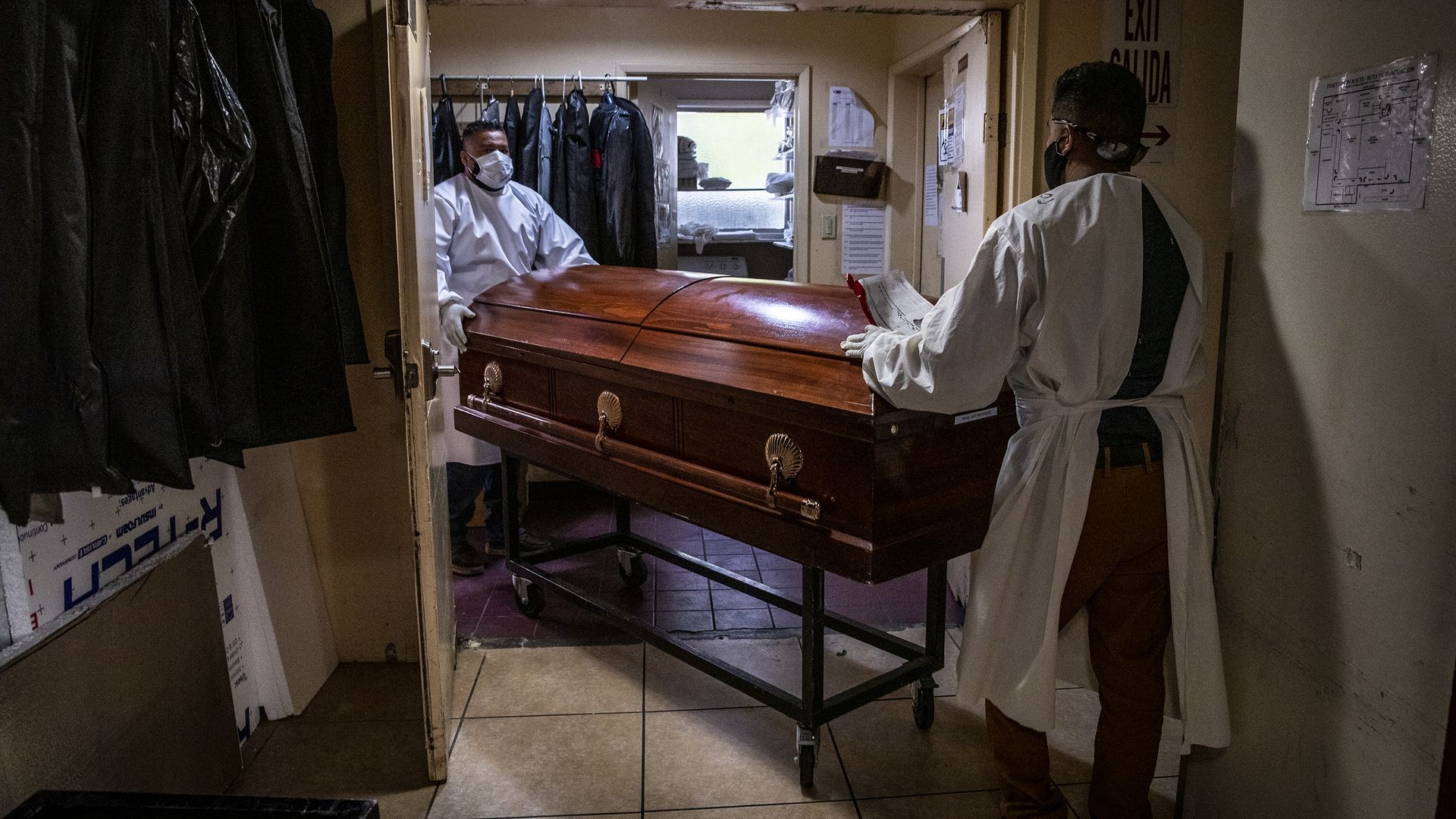 Continental Funeral Home attendants move a casket 