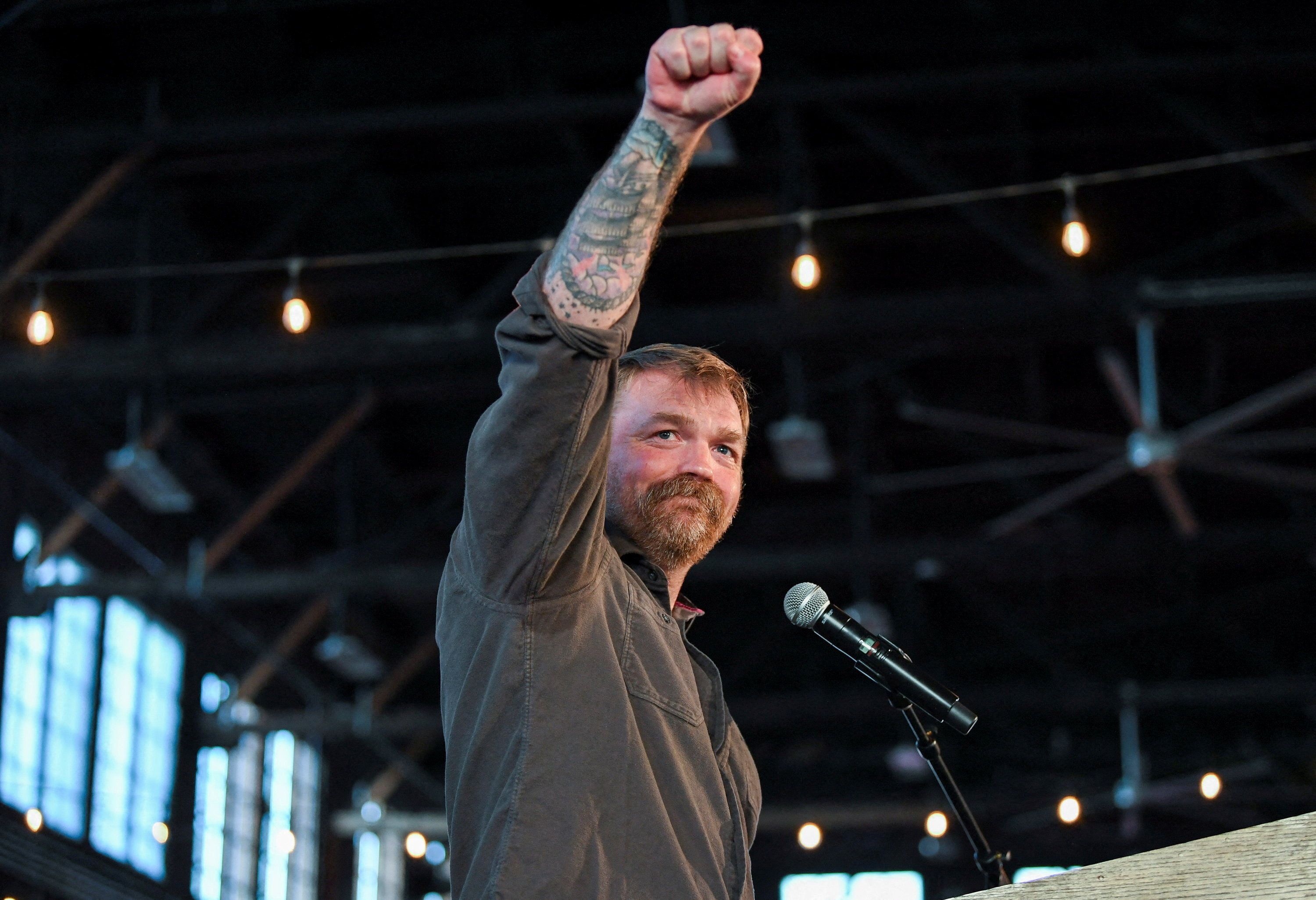 Graham Platner, Democratic candidate for U.S. Senate in Maine, gestures during a "Fighting Oligarchy" campaign rally with U.S. Senator Bernie Sanders (I-VT) in Portland, Maine, U.S., May 25, 2026. REUTERS/Amanda Sabga