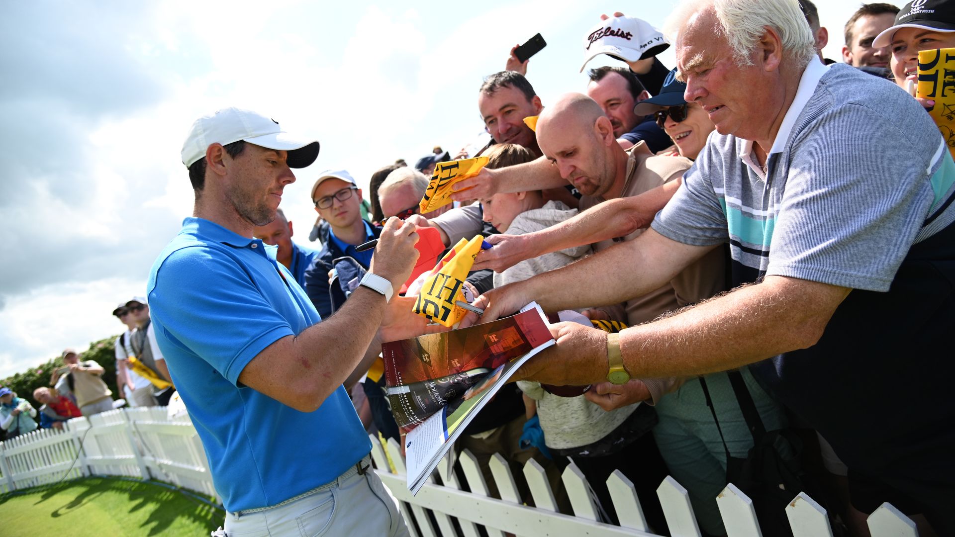 Rory McIlroy signing autographs