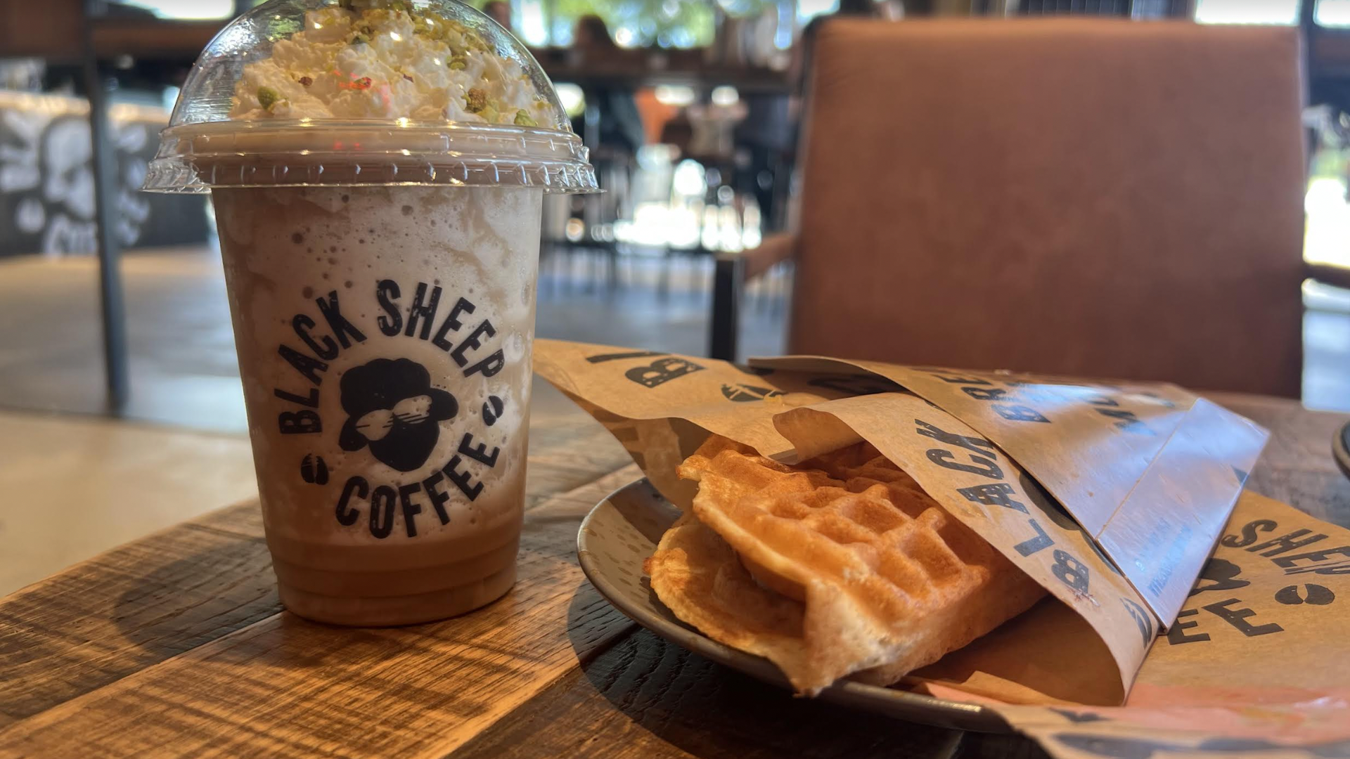 a photo of a frozen coffee and a waffle 